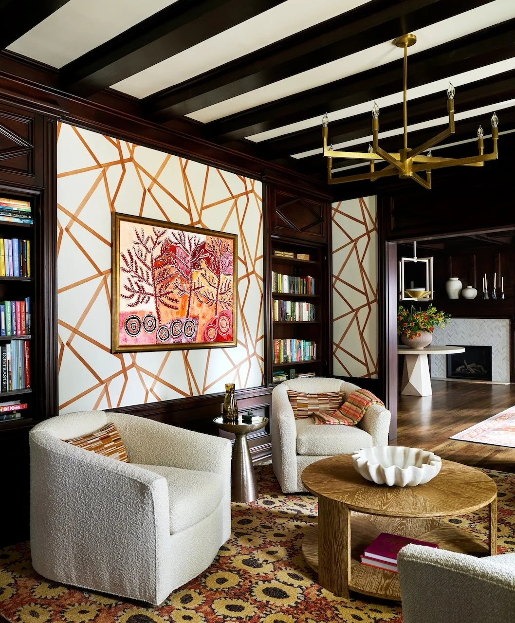 traditional living room beamed ceiling boucle chairs layered rugs 