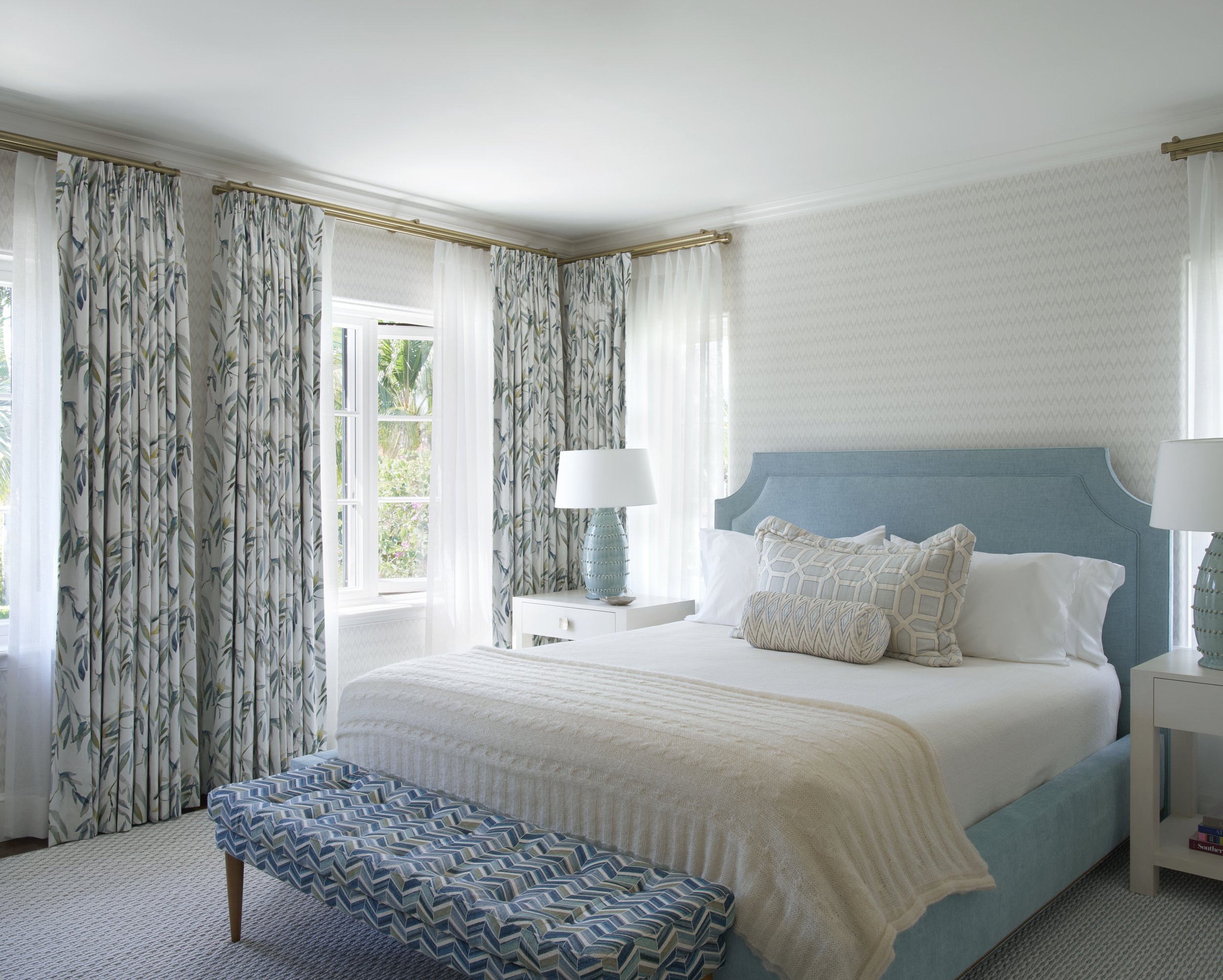 blue bedroom design with patterned curtains cozy upholstered bed coordinated interior décor