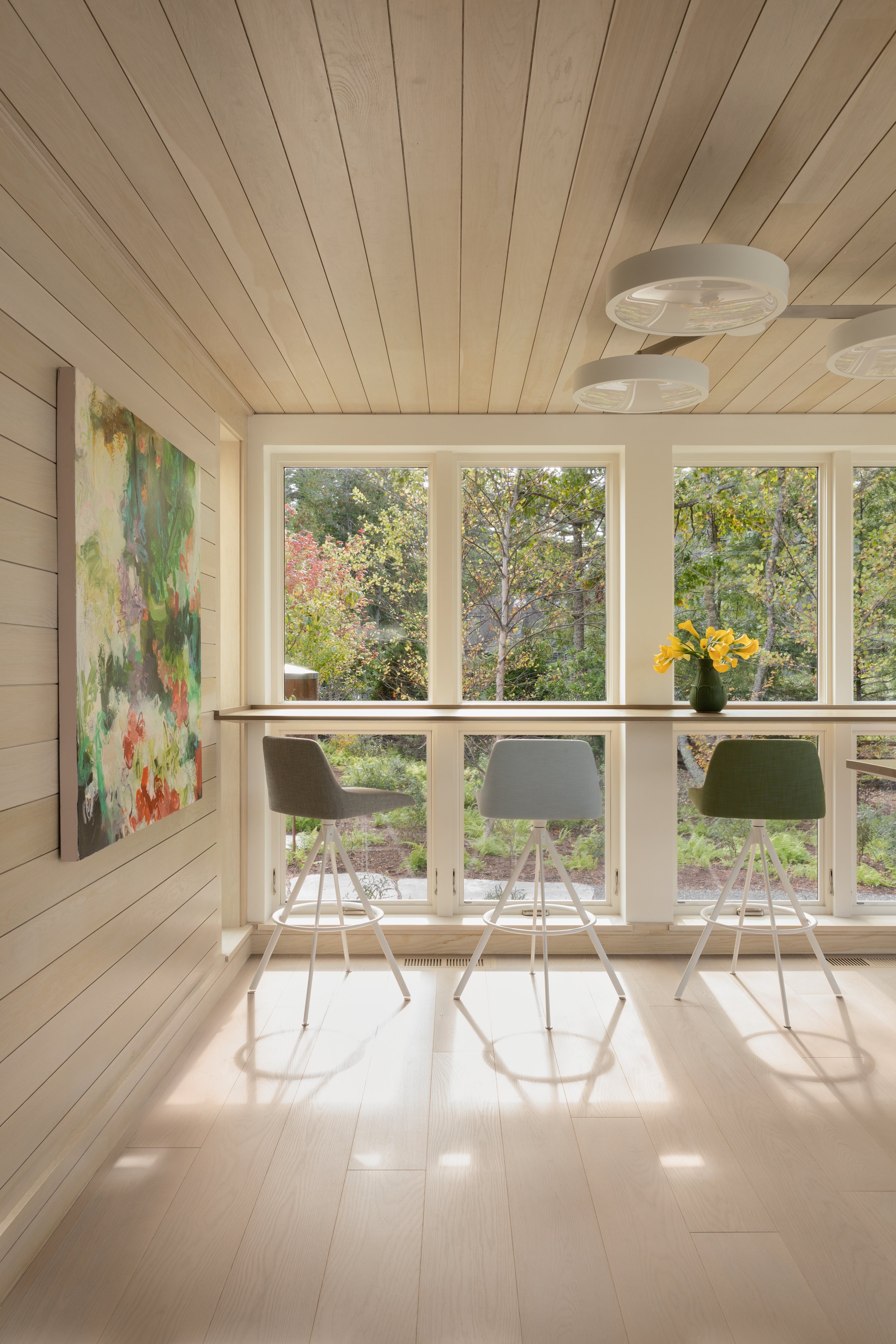 open sunroom with built in counter top and stools room with view