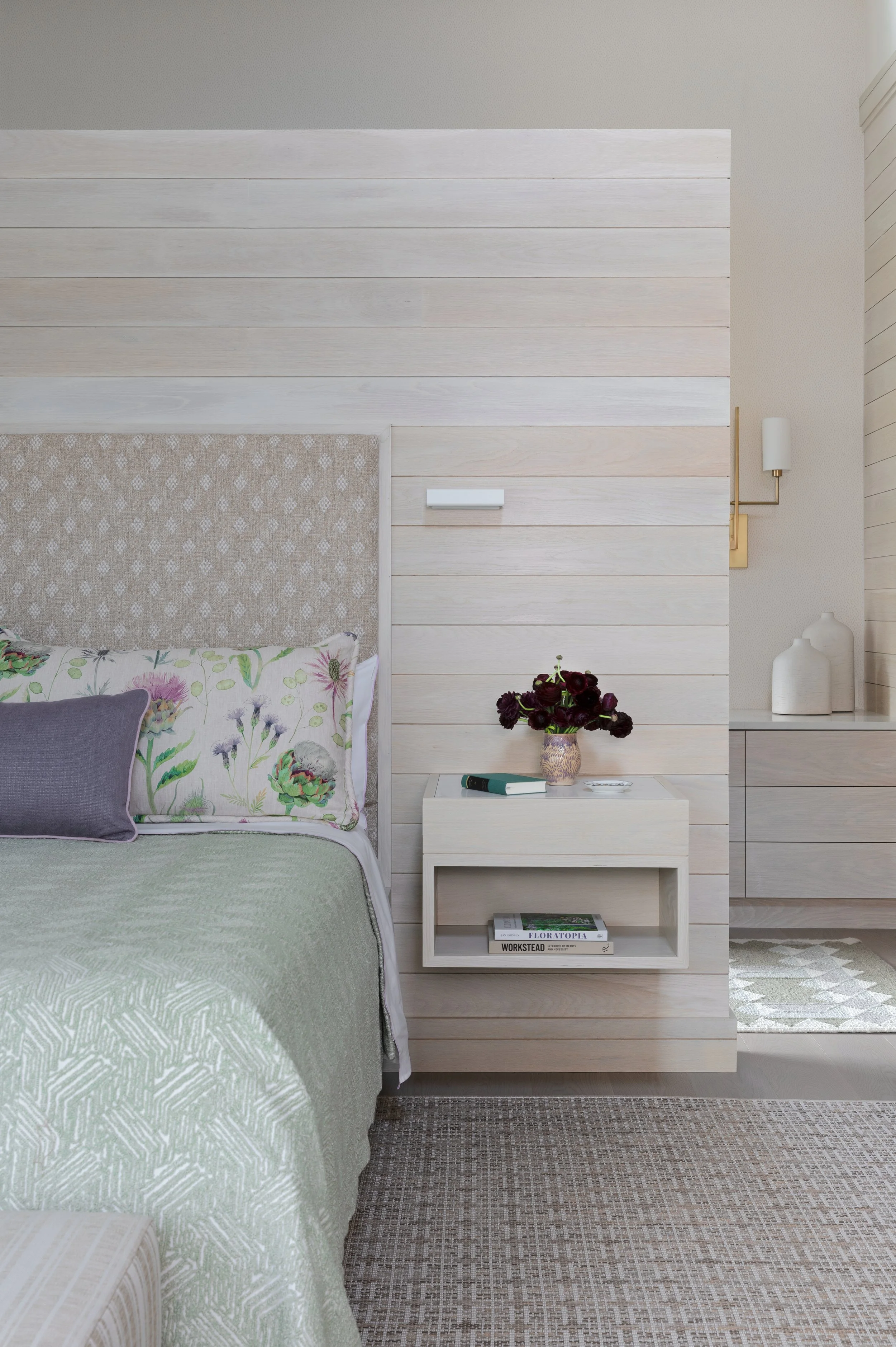 modern bedroom design with floating nightstand and cozy bedding