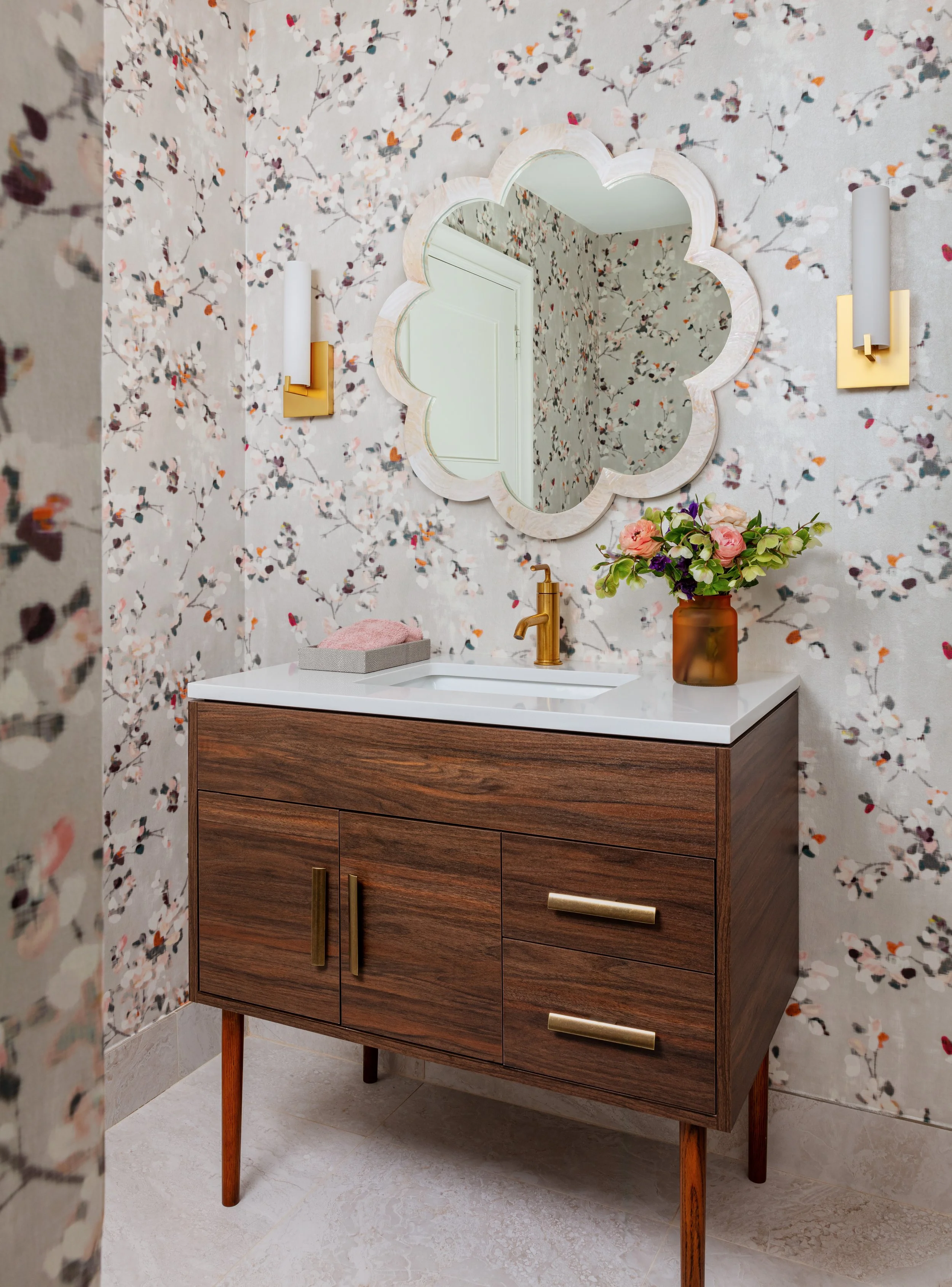 inviting-powder-room-with-wood-vanity-clover-mirror-wall-sconces-and-floral-wallpaper-design-inspiration.jpg