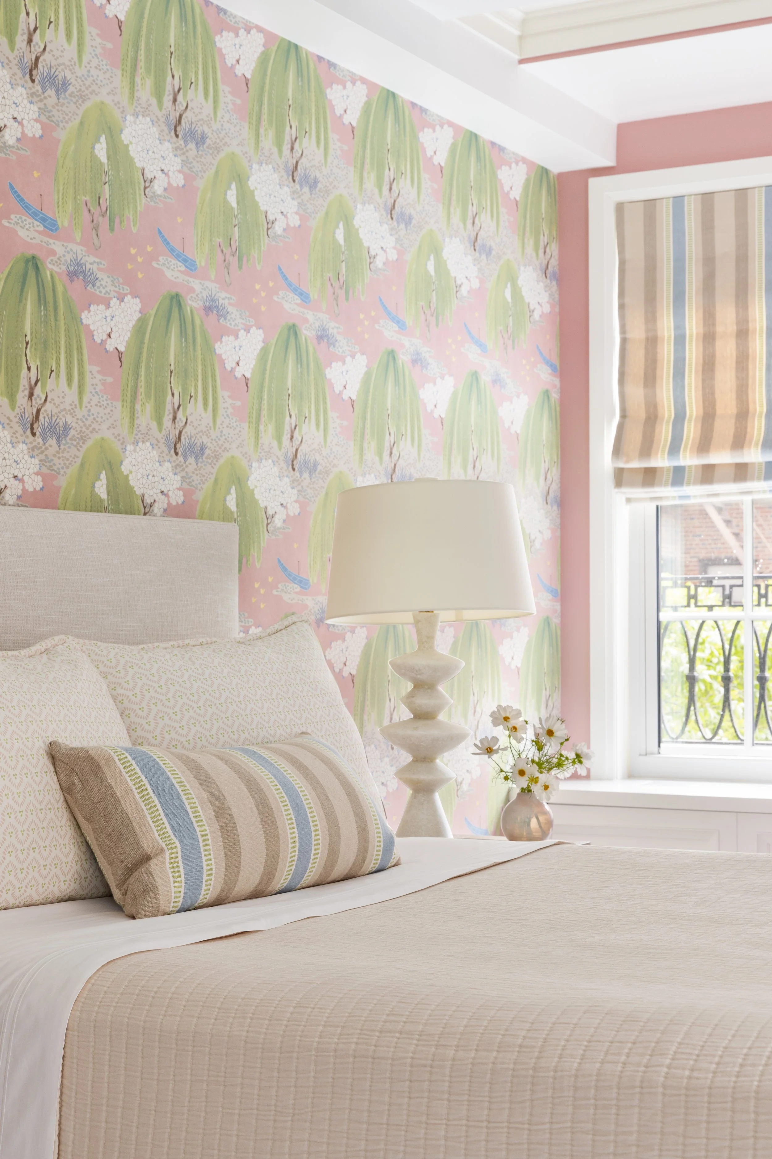 bedroom soft pink and green wallpaper comfortable bed and pastel fabric roman shade