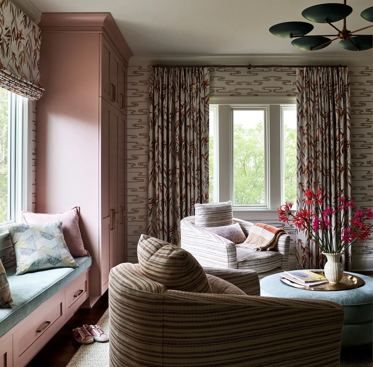 bedroom sitting area mauve built ins window seat botanical roman shade striped swivel chairs 