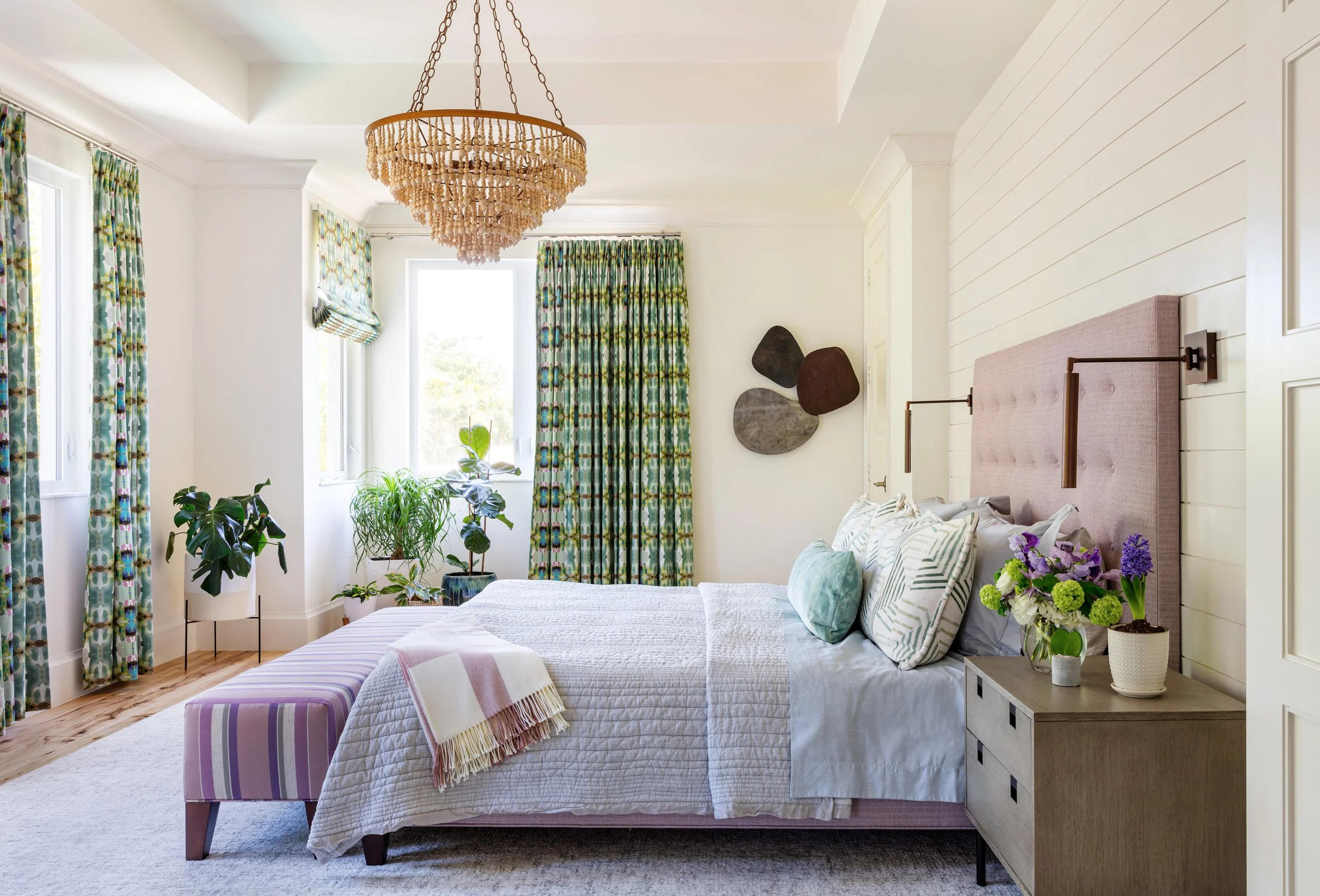 cozy-bedroom-design-with-purple-tufted-headboard-gray-quilted-bedding-green-floral-curtains-rattan-chandelier-and-modern-art-decor-for-interior-design-inspiration.jpg