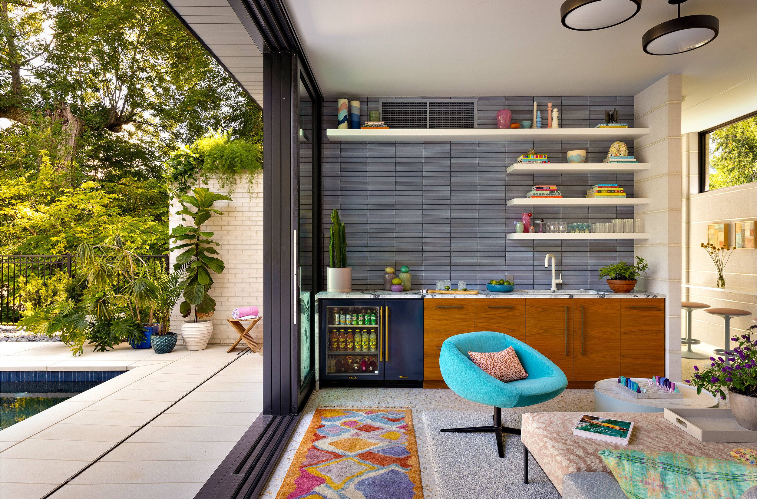 retractable door to open pool house seating area to pool 