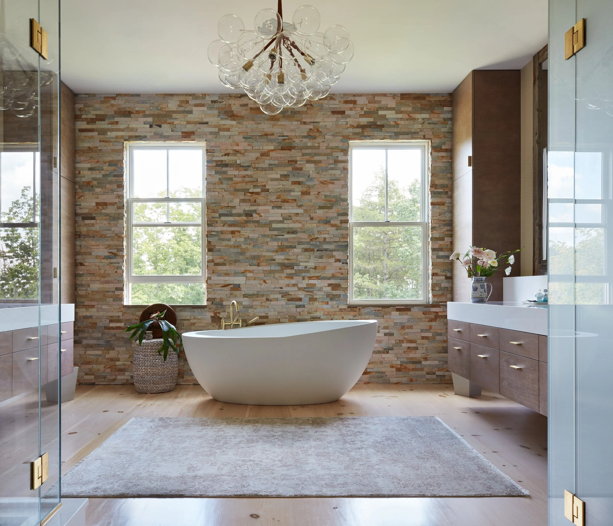 modern-bathroom-design-with-freestanding-tub-chandelier-stone-wall-wood-vanity-for-interior-design-inspiration-and-elegant-spa-ambiance-guide.jpg