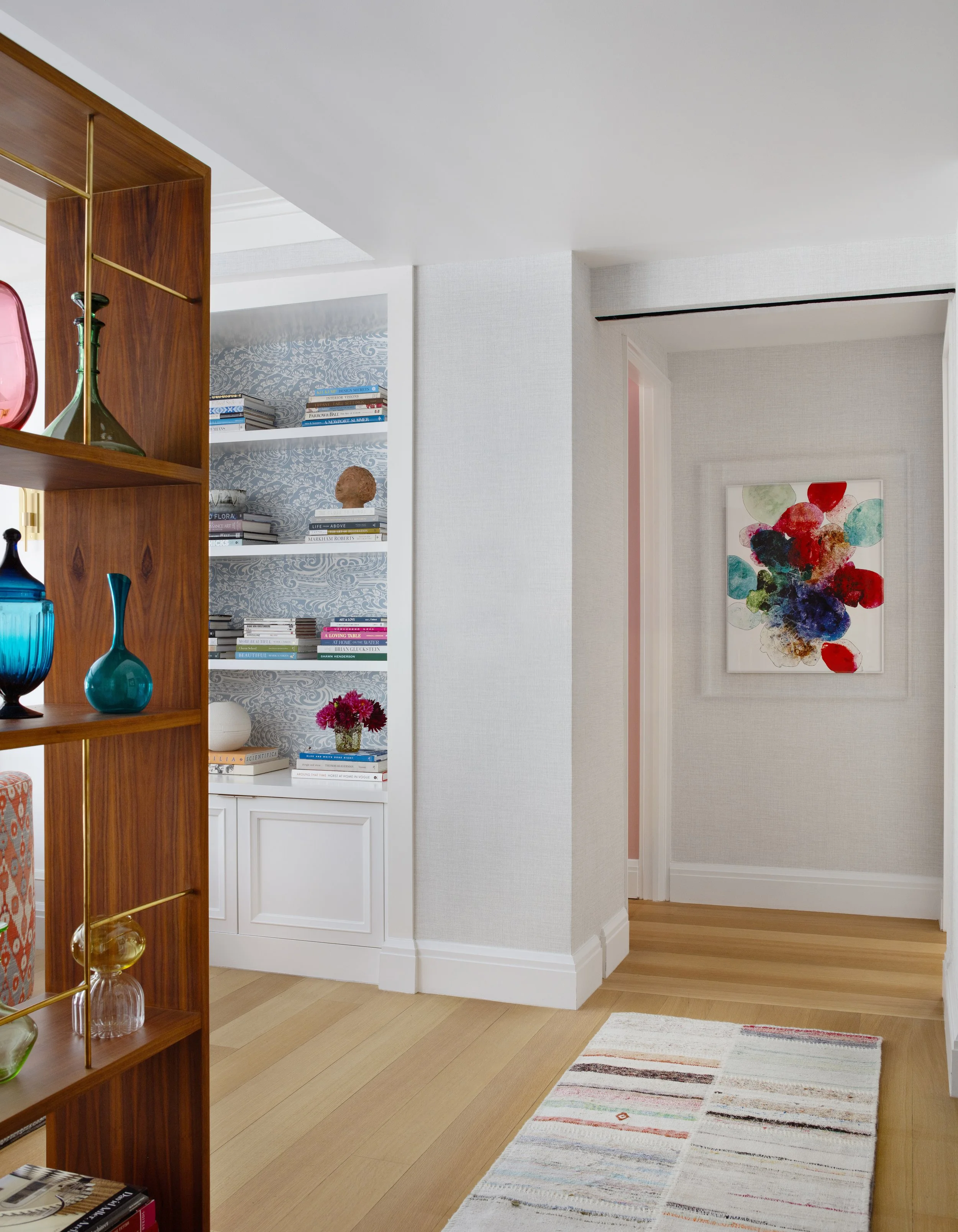 stylish hallway with artwork built in bookcase chic accessories