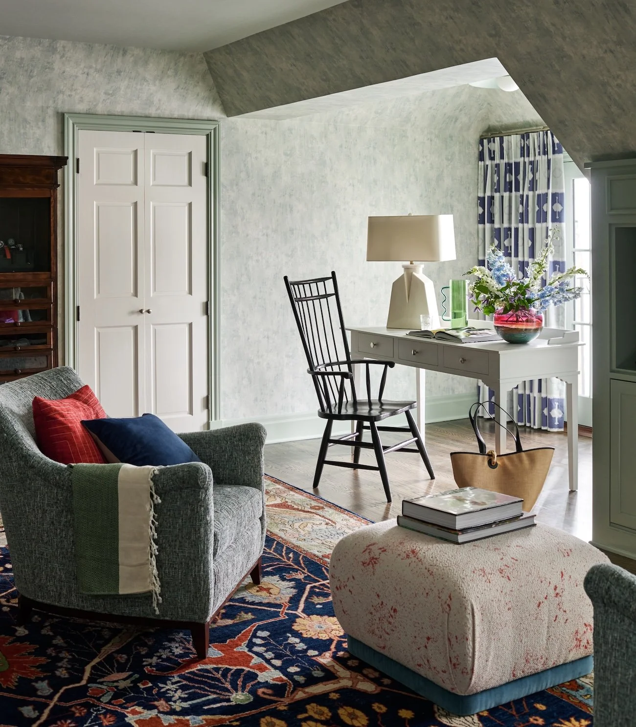 Cozy reading chair and desk nook for traditional Pittsburgh bedroom 