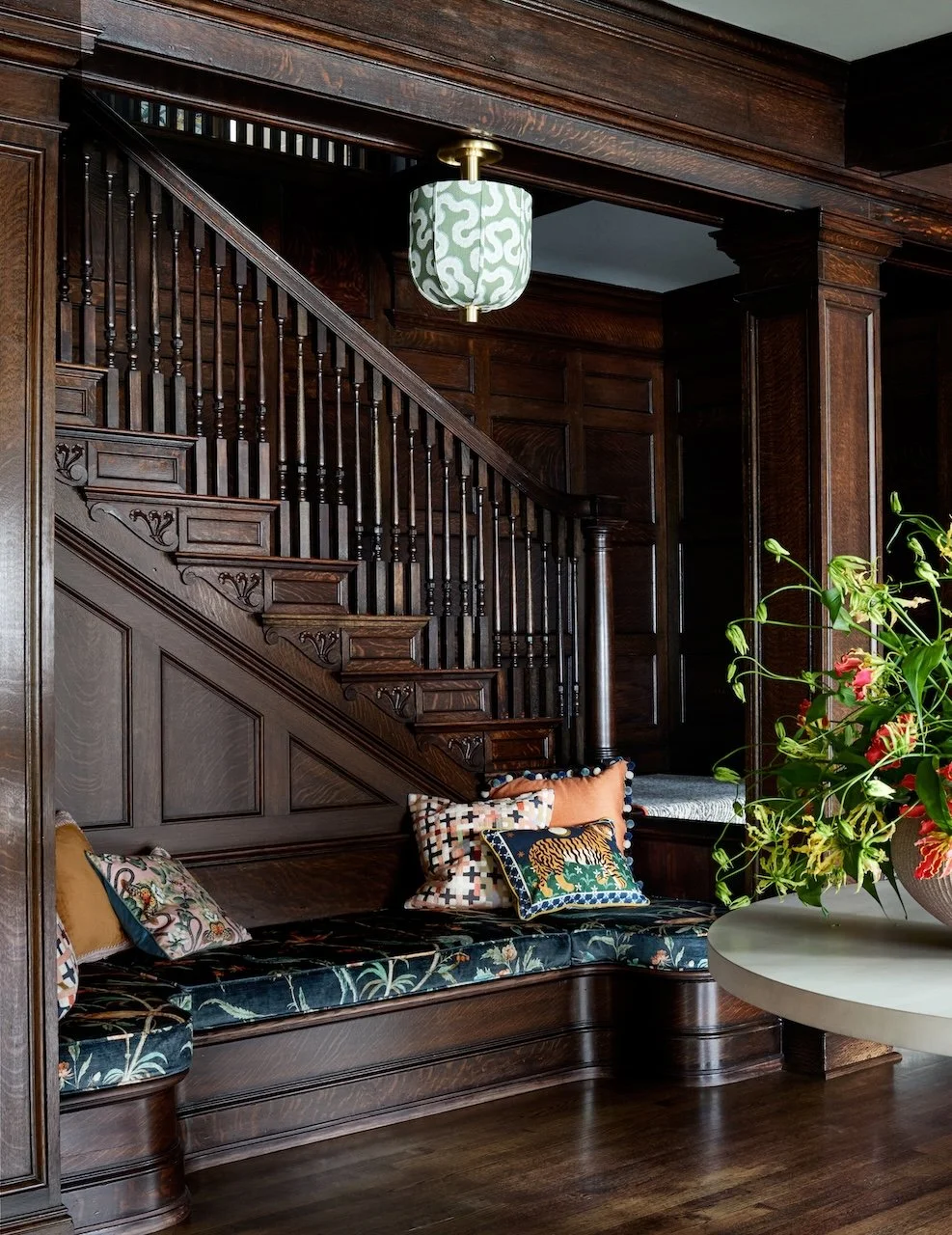 historic pittsburgh carved wood paneled entry with curved built in bench 
