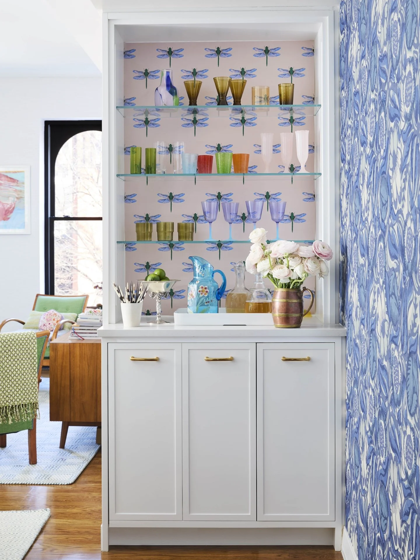 built in bar cabinet glass shelves colorful glassware dragonfly wallpaper blue patterned accent wall modern home design