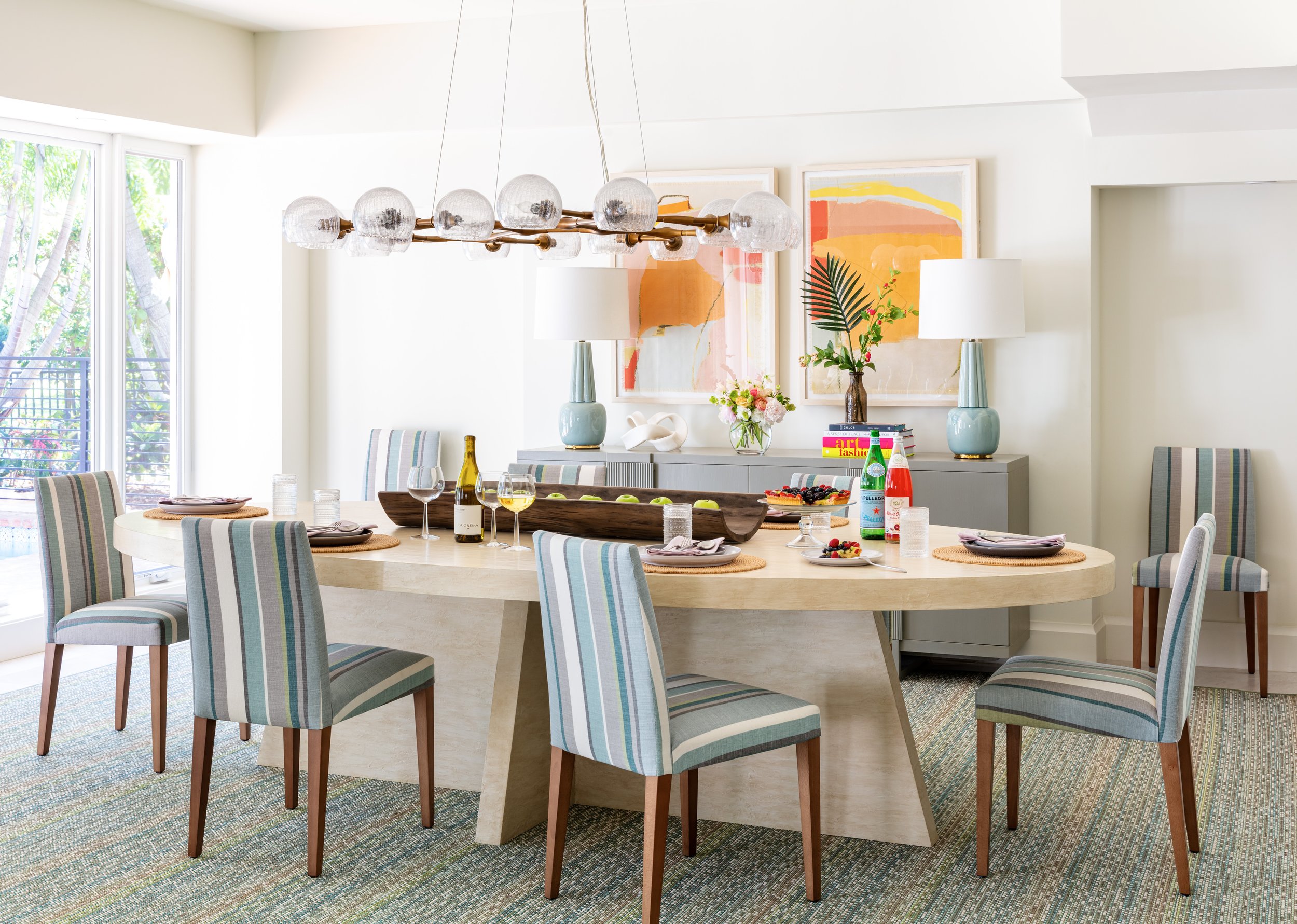 stylish-oval-dining-table-with-blue-striped-chairs-modern-interior-design-inspiration-for-coastal-home-decor-and-elegant-dining-spaces.jpg