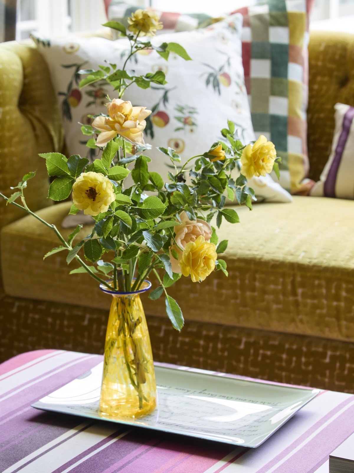 Colorful pittsburgh family room details stiped ottoman and ochre velvet sofa