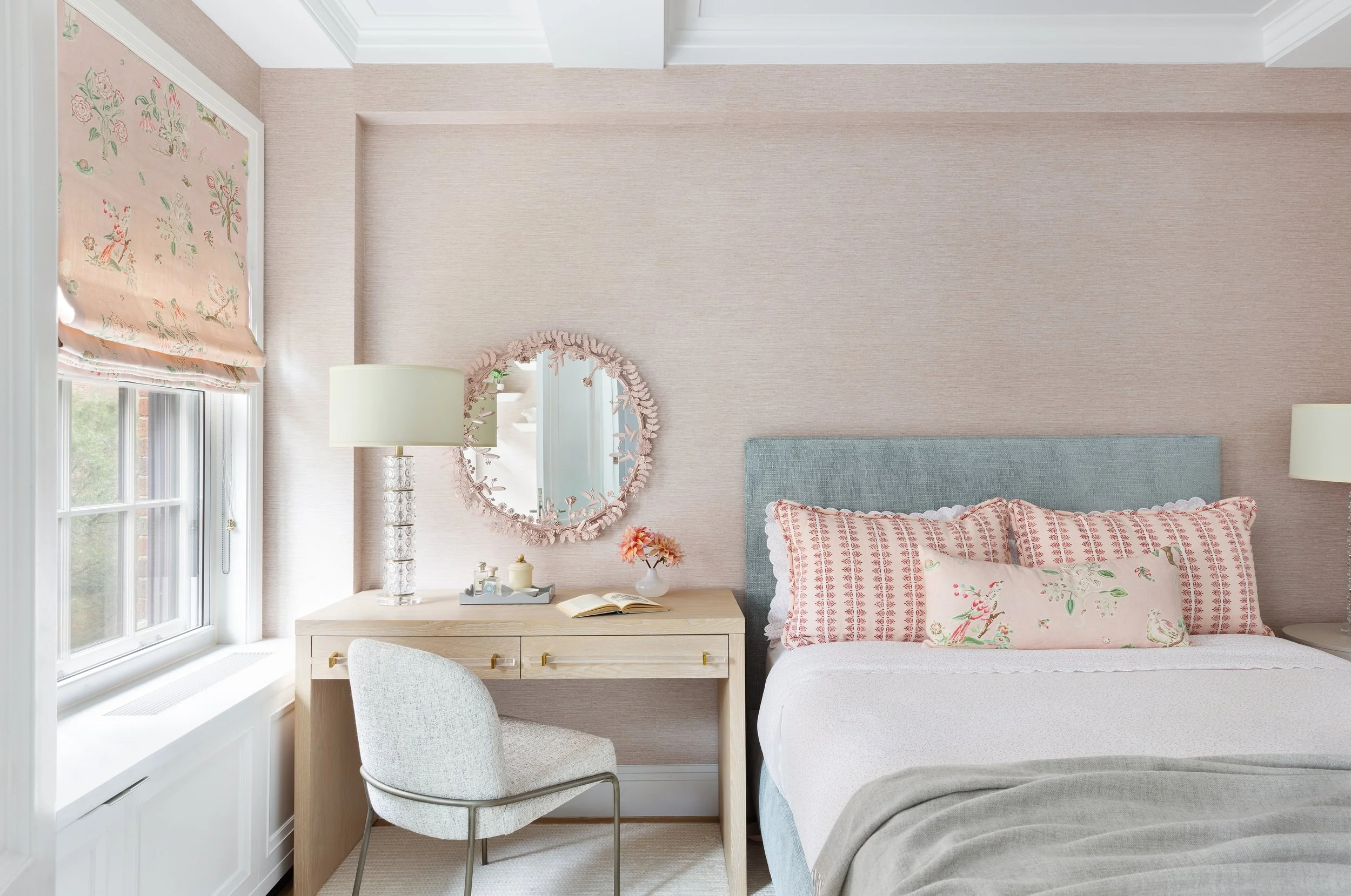 cozy bedroom soft pastel walls wood floors comfortable bed reading desk and chair