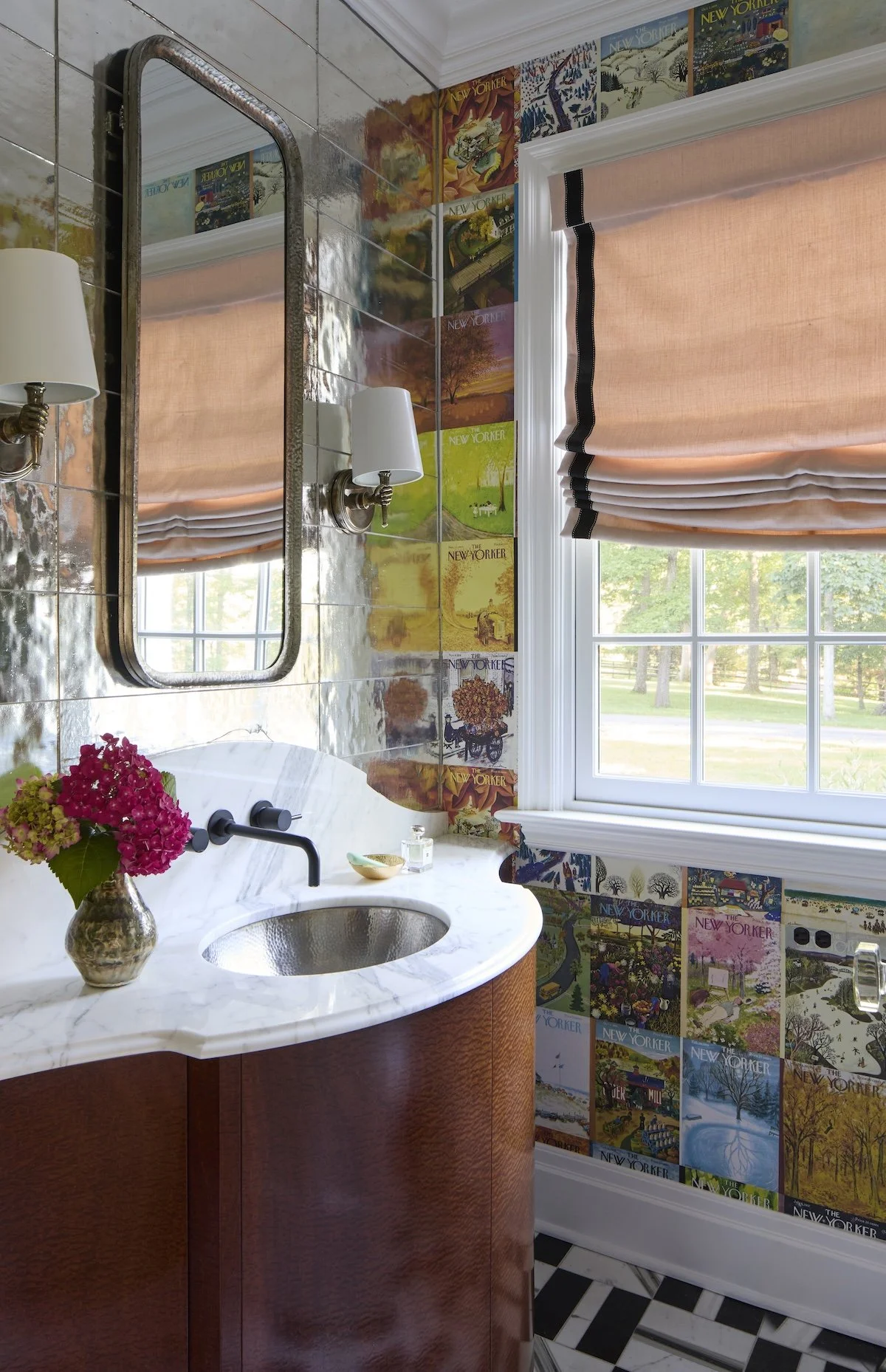 whimsical powder room with new yorker magazine cover wallpaper mirrored wall tiles curved marble sink and black white checkered floor by betsy wentz