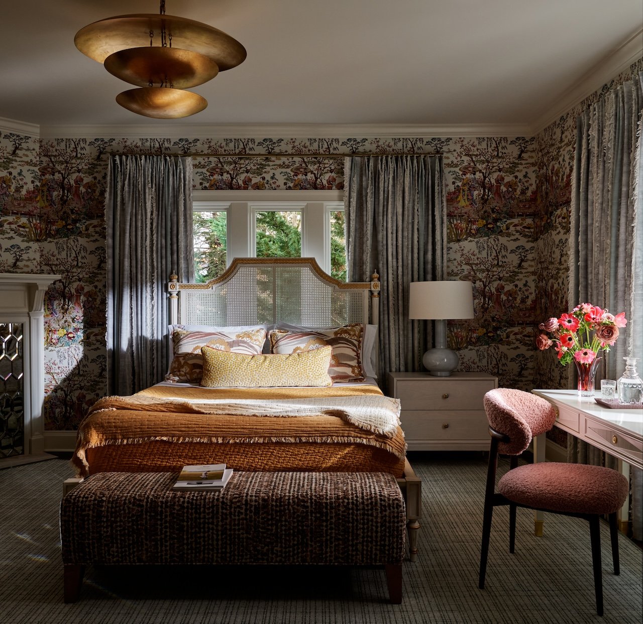Collected bedroom chinoiserie wallpaper fringed velvet drapes marbleized pillows crisp linens and fresh blooms