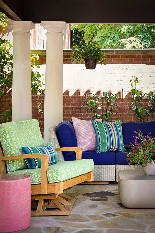 bright fun colorful blue sofa green swivel chairs and pink end tables