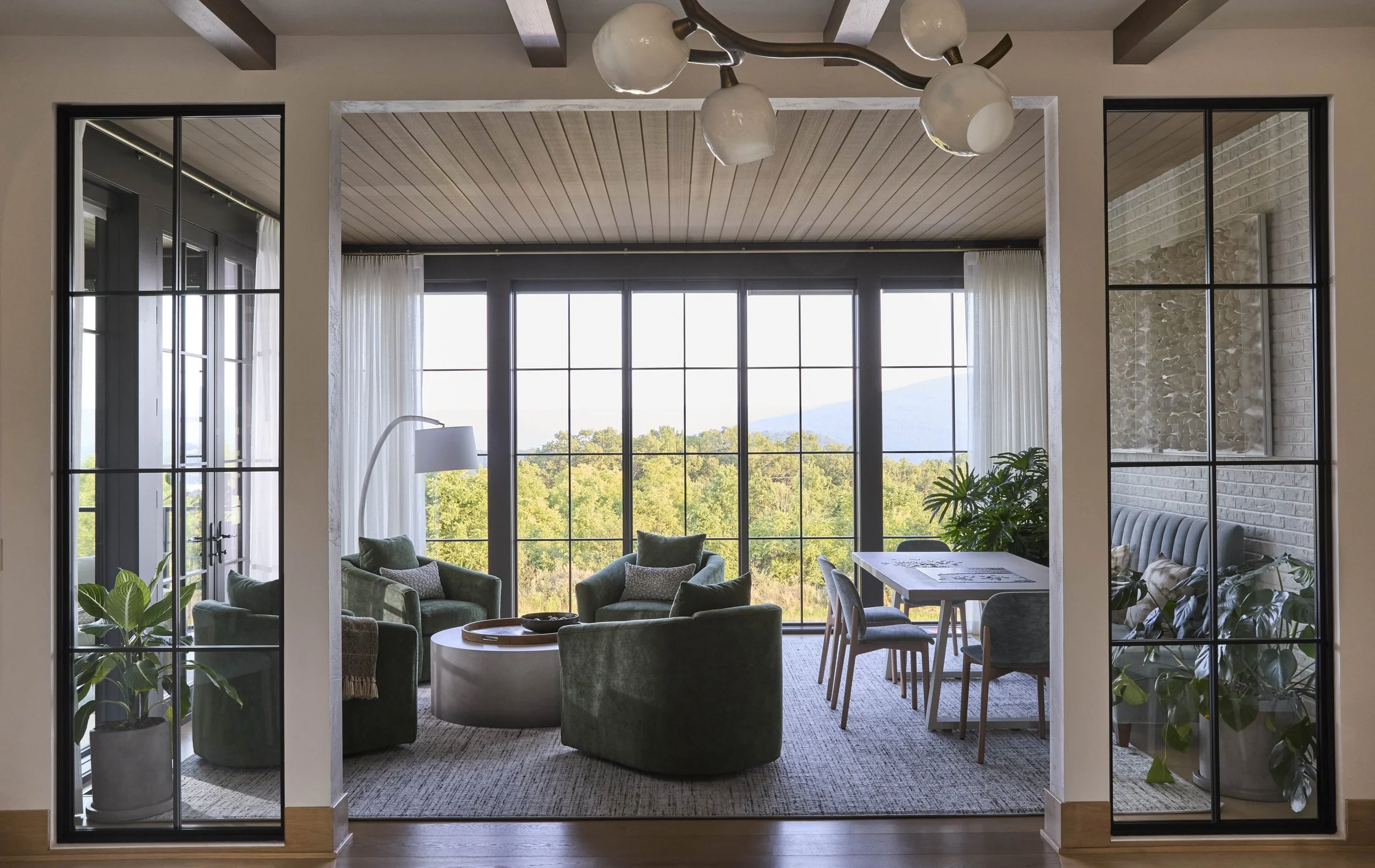 transisitonal-family-room-with game-table-and large-windows.jpg