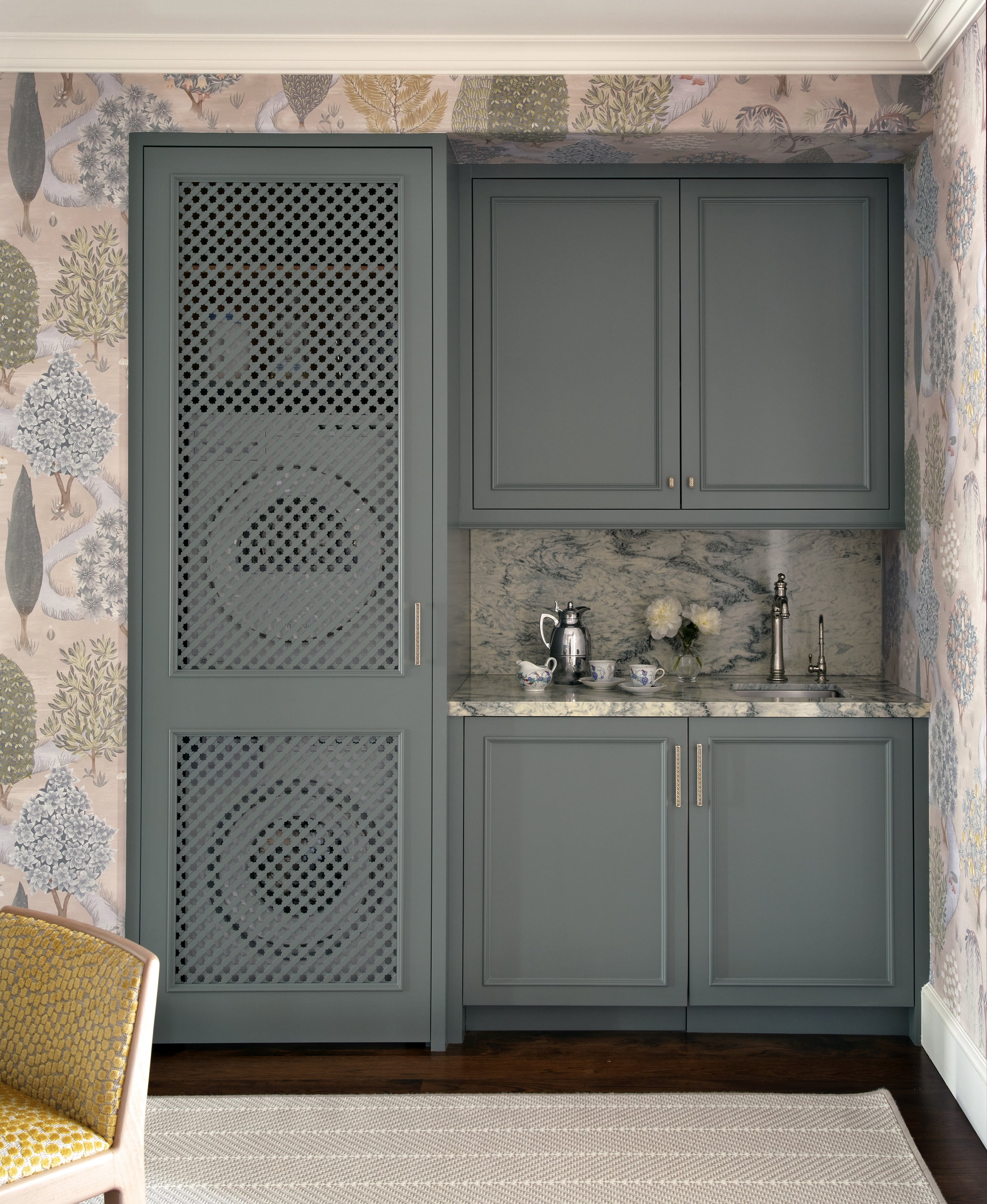 blue wet bar cabinets with marble countertop and patterned wallpaper design modern kitchenette space showcasing elegant cupboards and accessories