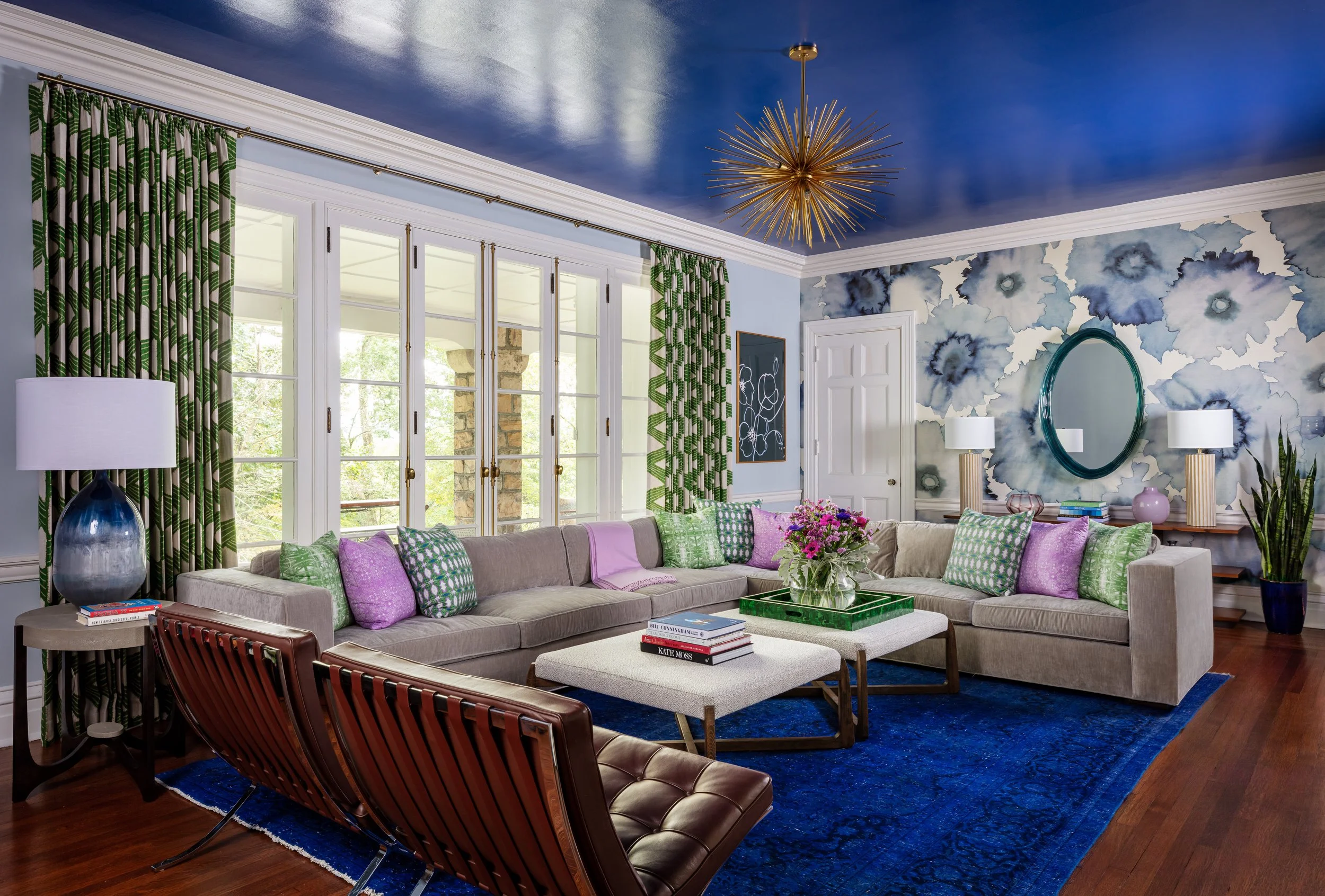 vibrant-family-room-historic-home-bold-wallpaper-painted-ceiling-comfortable-sectional-eclectic-style-fun-gatherings.jpg