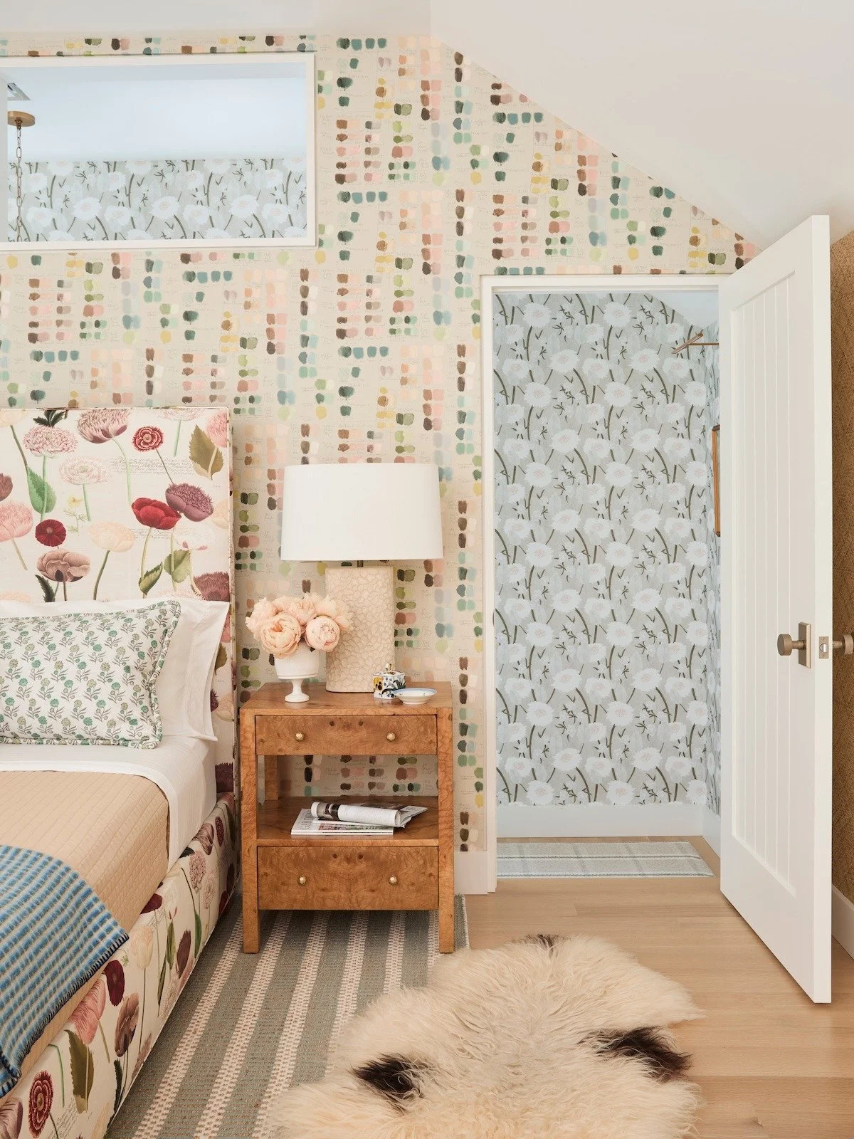 pittsburgh-fox-chapel-log-cabin-loft-bedroom-sheepskin-rug-burl-nightstand-floral-bed.jpg