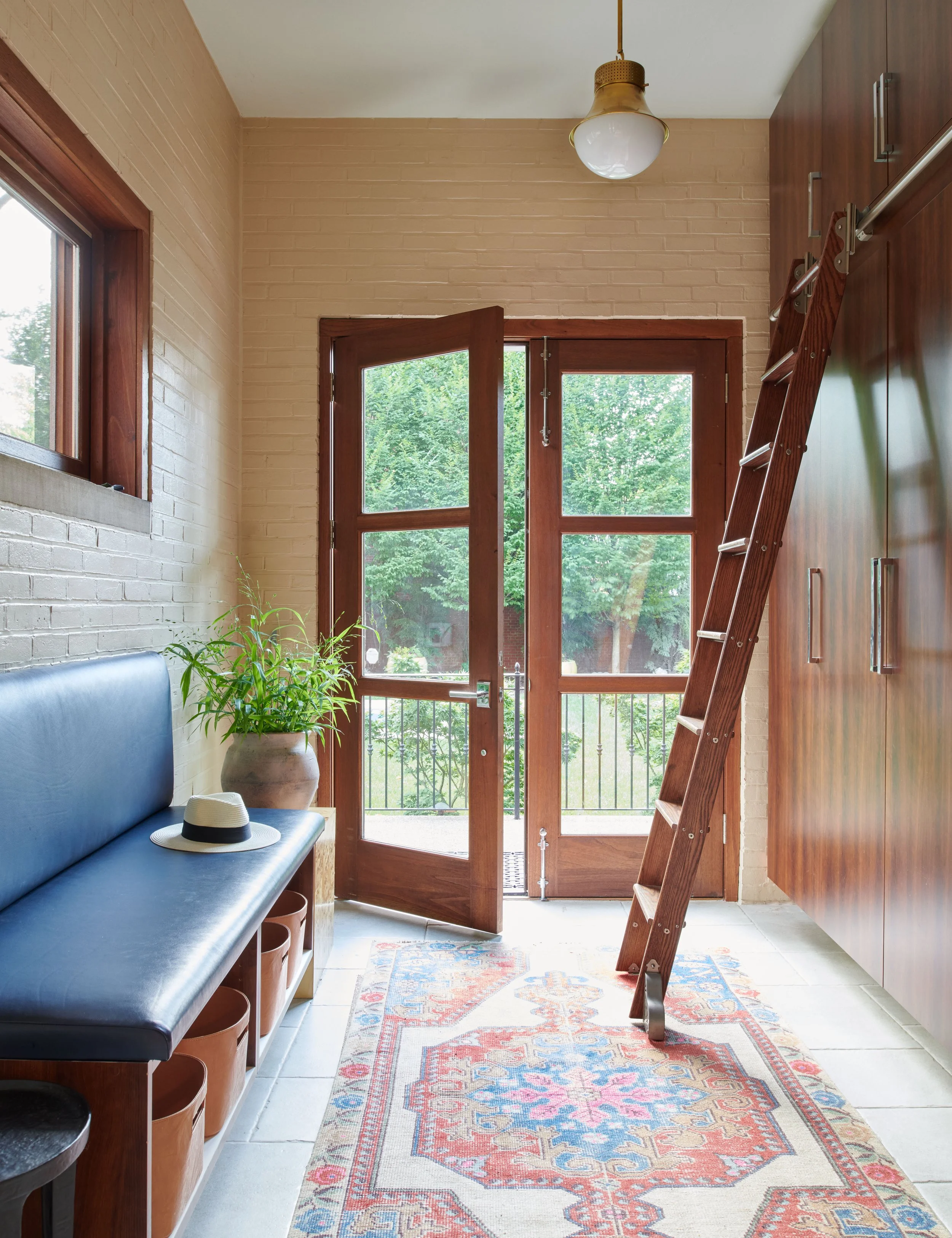 welcoming-entryway-with-built-in-bench-seat-and-large-windows.jpg