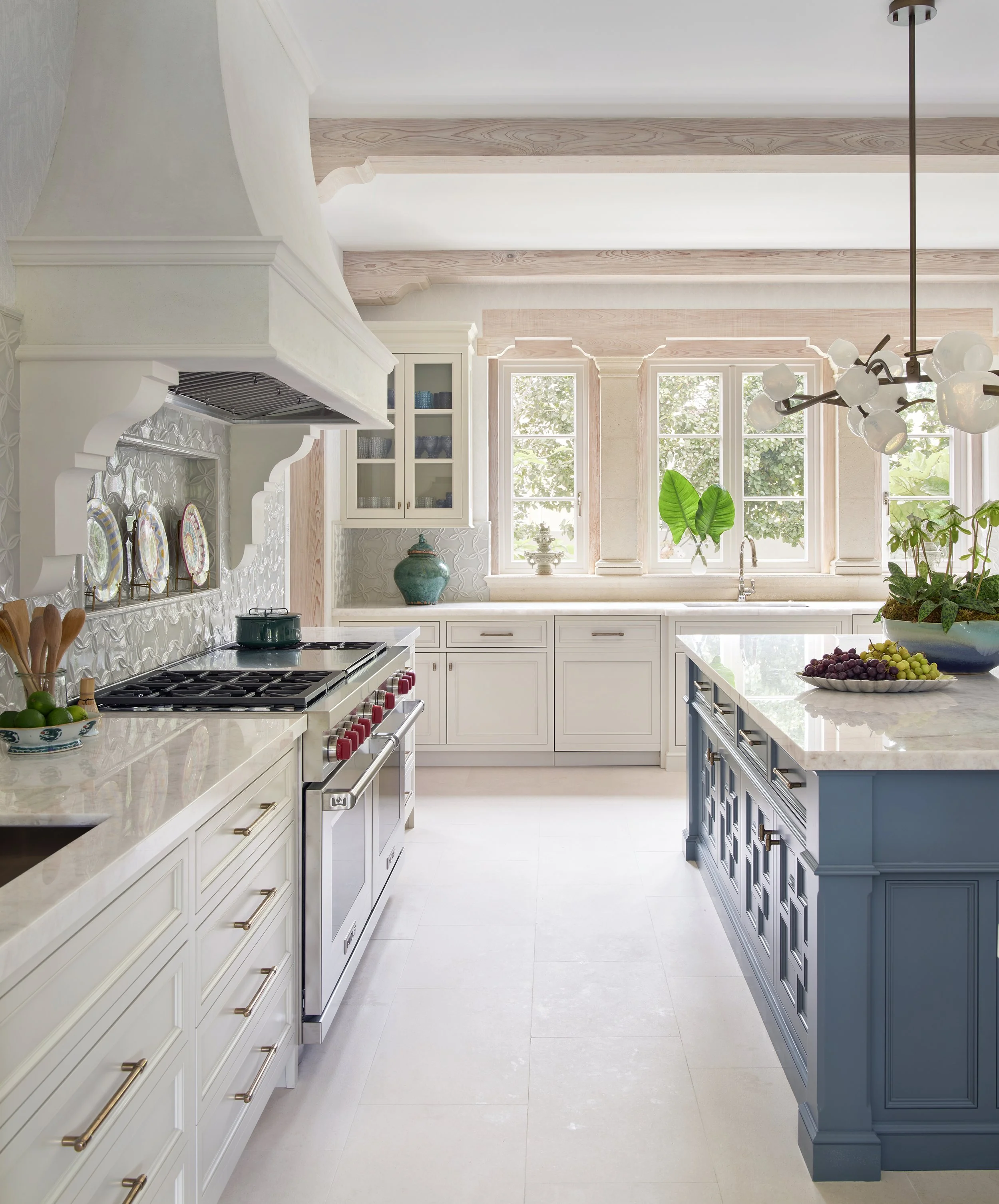 classic traditional kitchen design with white cabinets blue island marble countertops exposed wood beams modern appliances luxury inspiration for cooking space