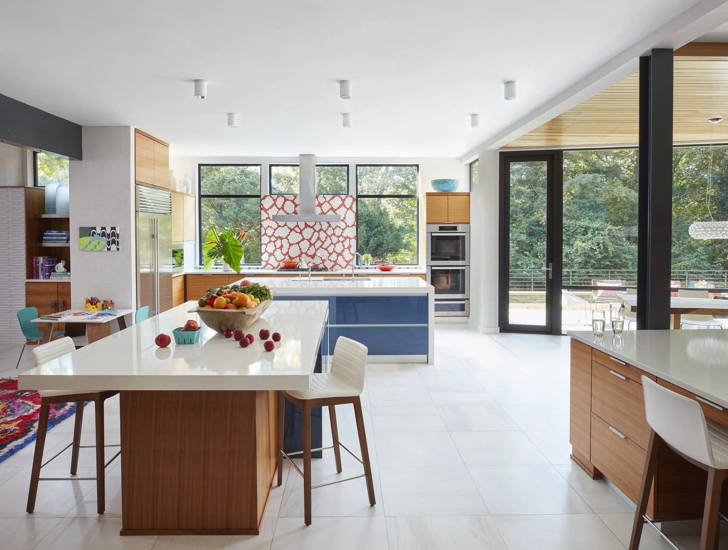 vibrant open plan kitchen with colorful backsplash and modern appliances perfect for cooking and gathering