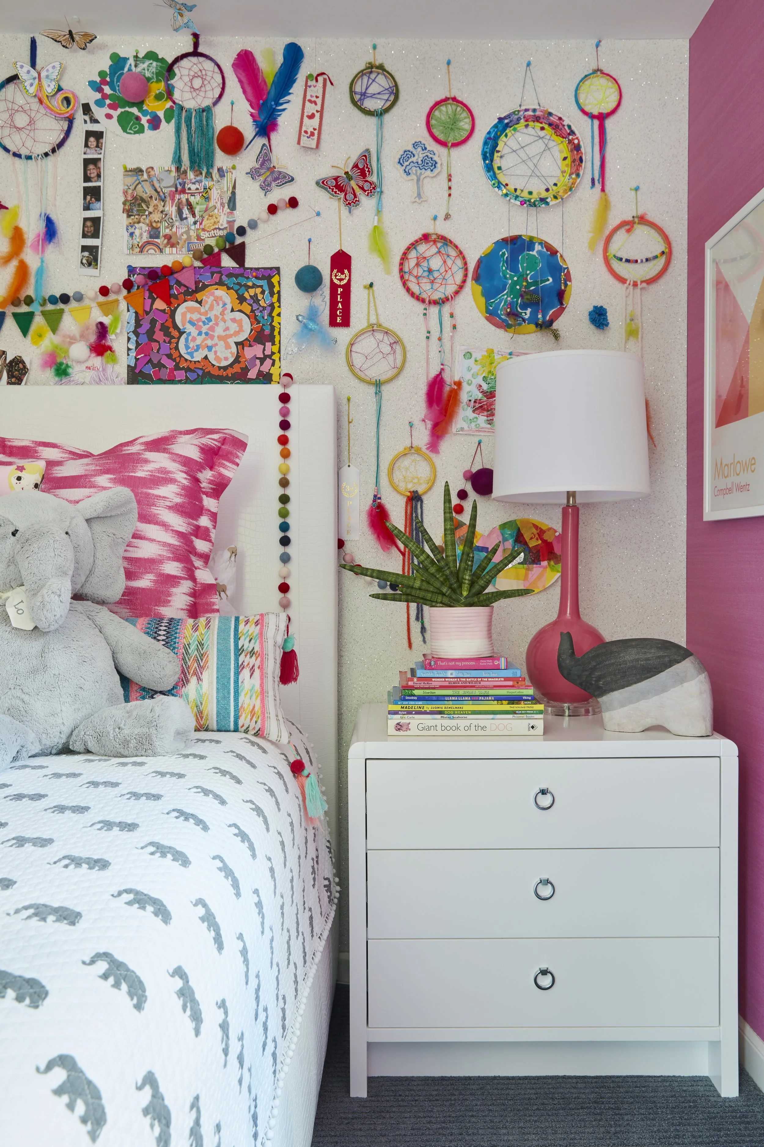 kids bedroom with white bed and nightstands cozy bedding