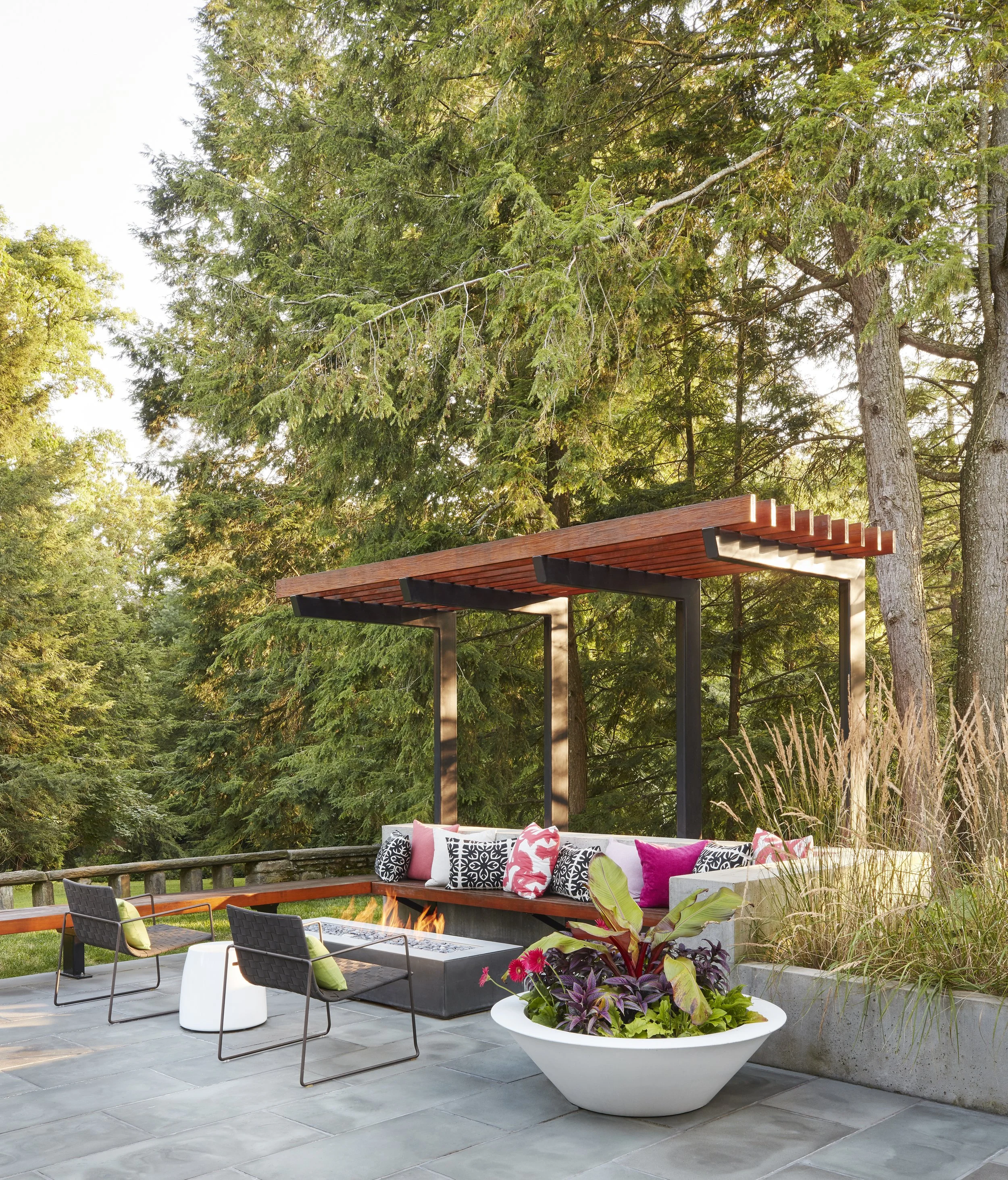 pergola with custom wood beams built in seating fire pit modern exterior design luxury backyard renovation