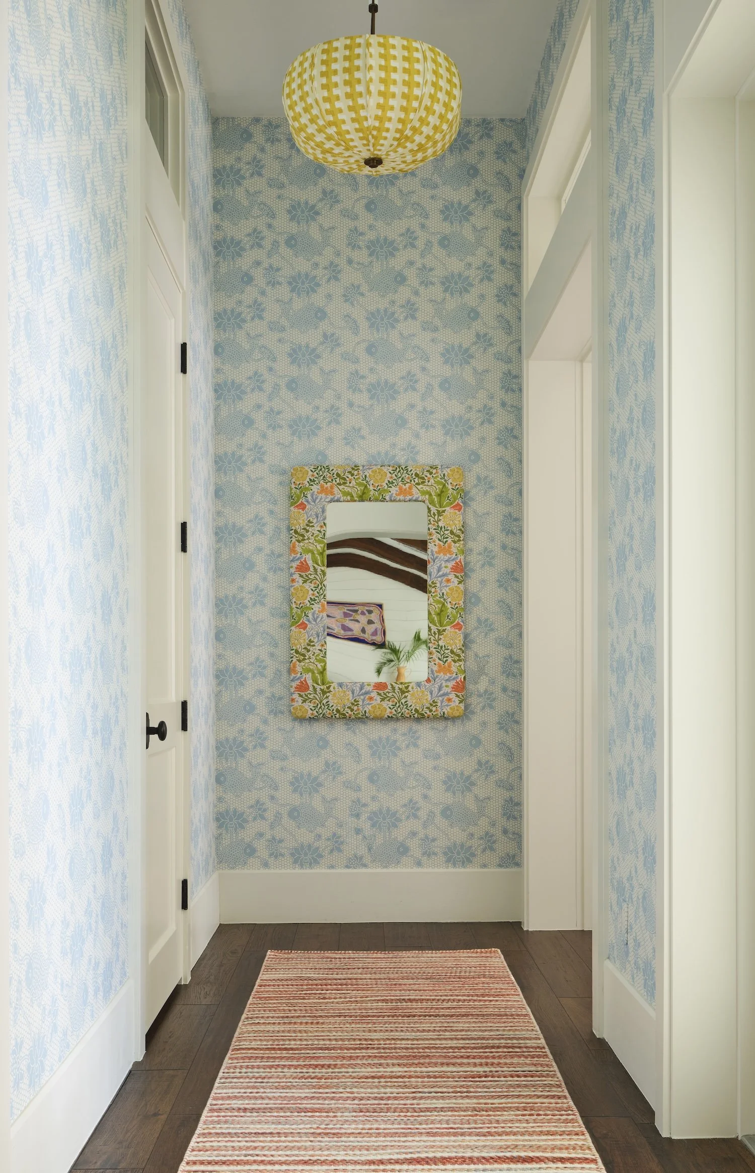 20-coastal-hallway-blue-patterned-wallpaper-yellow-lantern-mirror-striped-runner-bright-playful-design.jpg