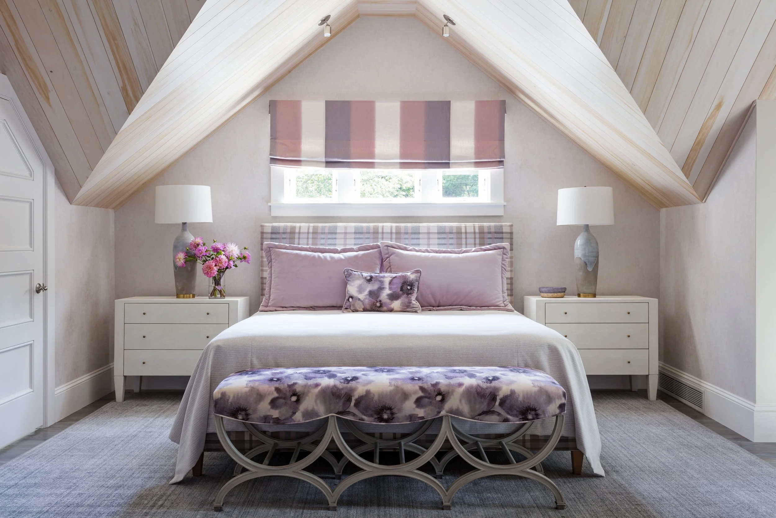 cozy-bedroom-design-with-sloping-roof-and-stylish-pink-purple-decor.jpg
