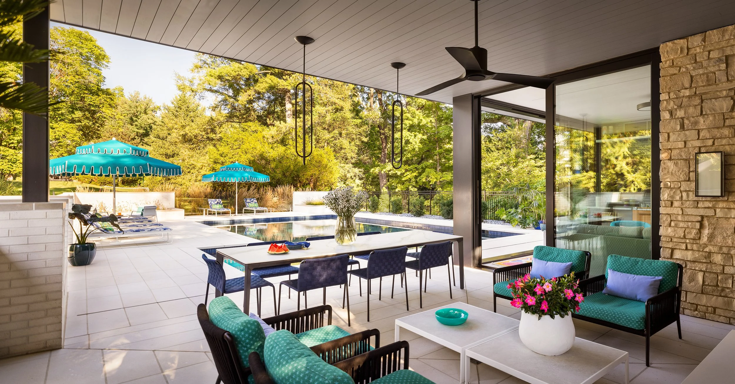 covered patio for pool house dining and seating area with view of pool