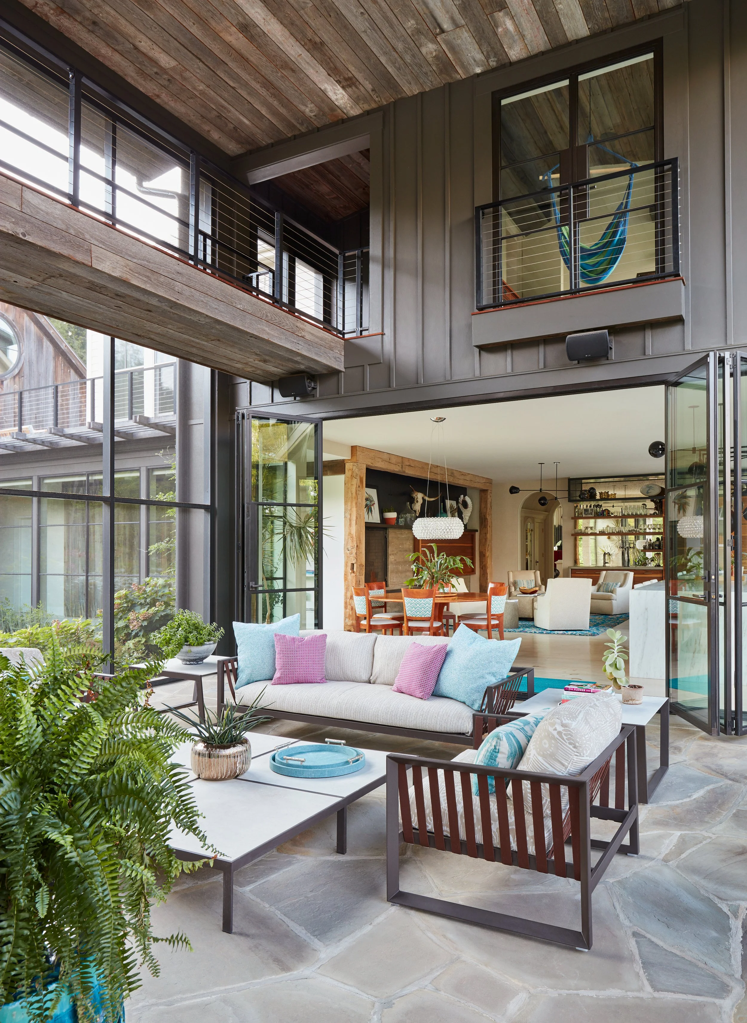 staylish-modern-screened=porch-with-cozy-seating-area-featuring-indoor-outdoor-living-nature-inspired-modern-design.jpg