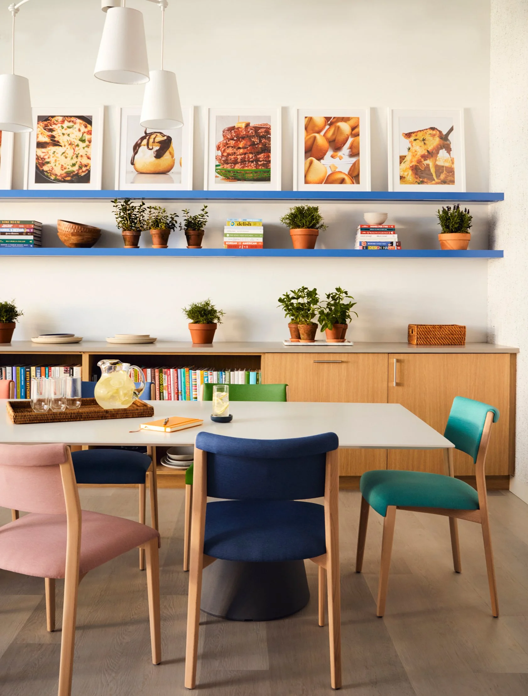 delish-test-kitchen-conference-table-cookbooks-food.jpg