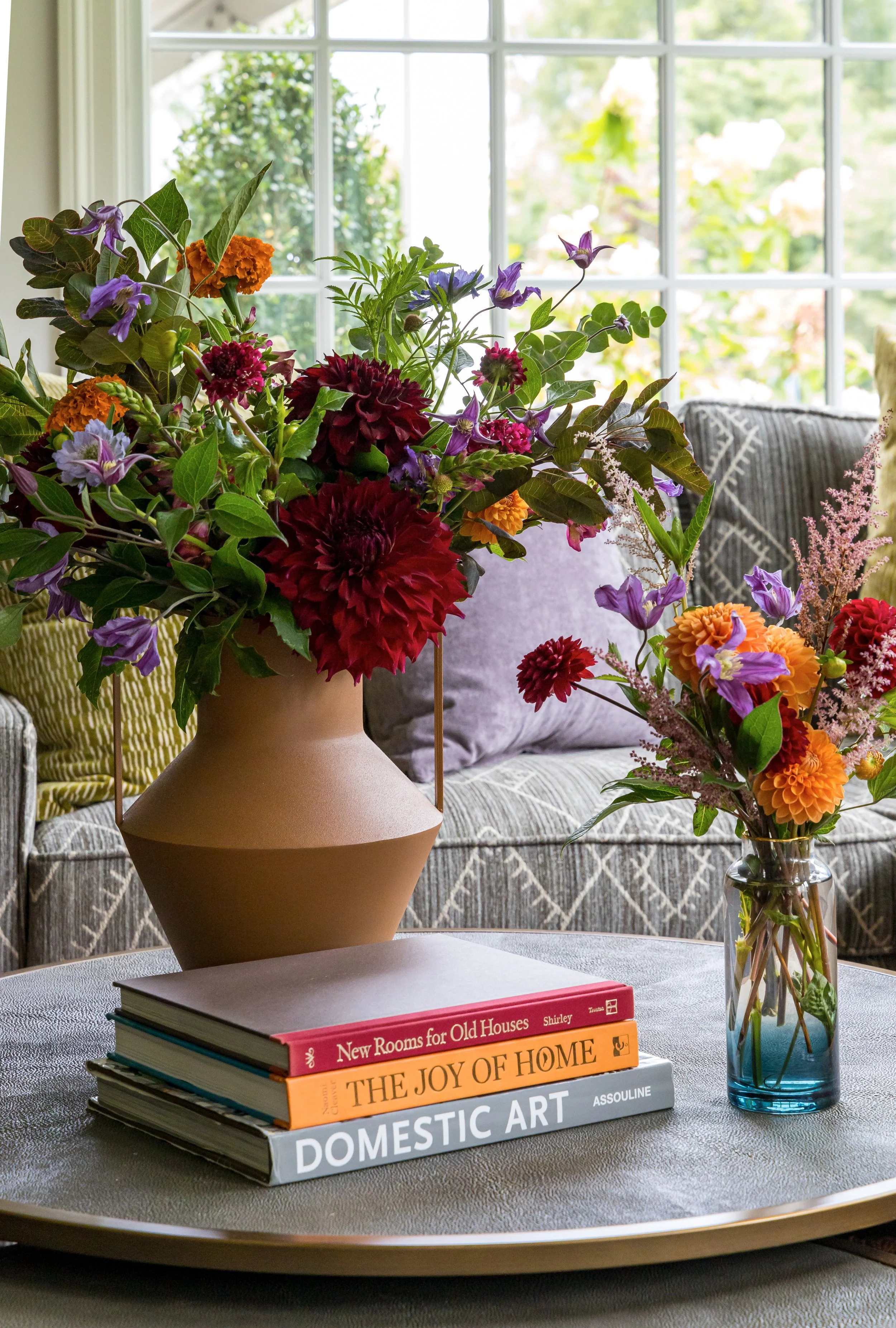 flowers and books on coffee table accessories