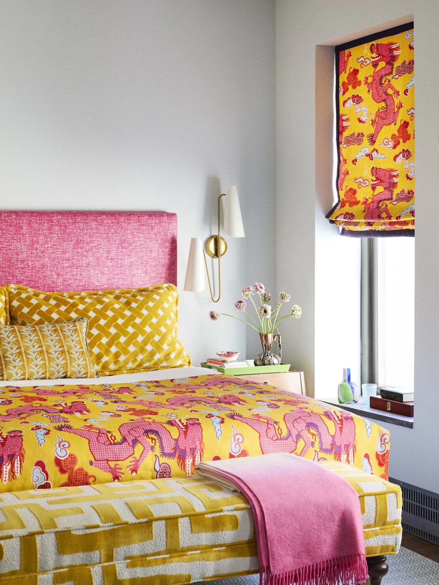 colorful bedroom pink headboard yellow bedding dragon print fabric bold patterns modern design style