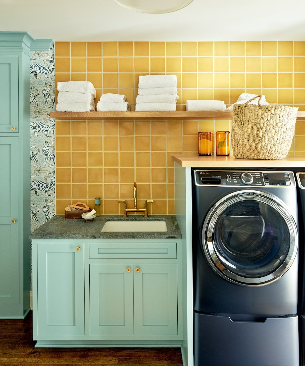 Laundry room renovation yellow tiles mint green cabinets
