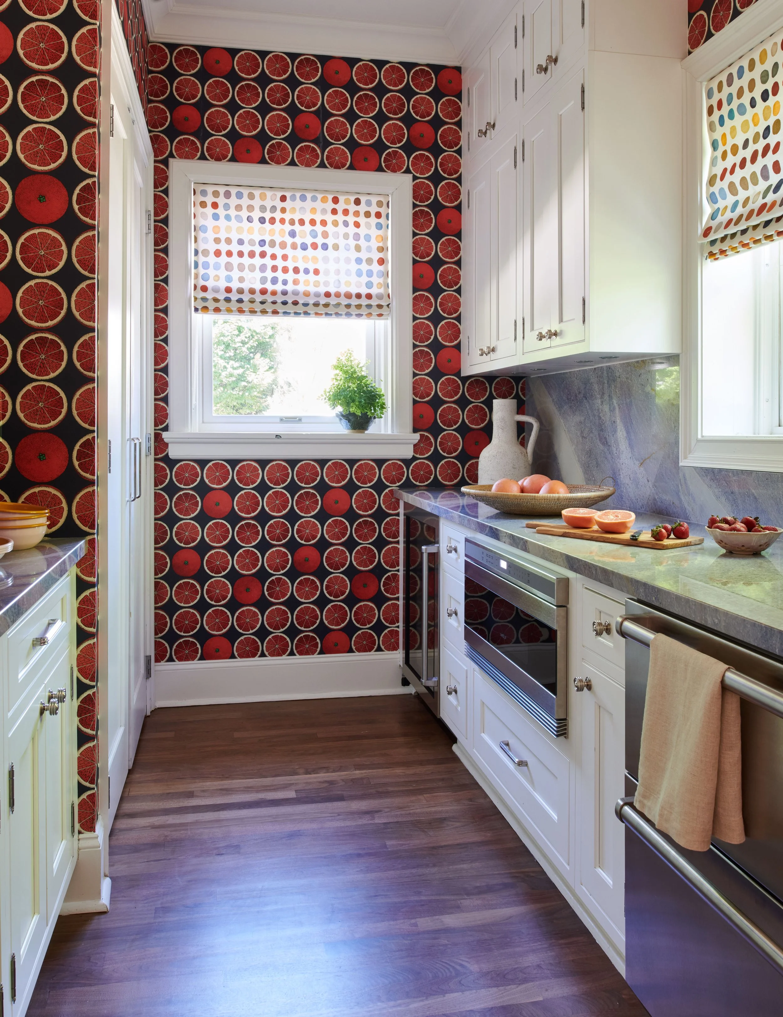 elegant-pantry-with cabinets-and-colorful-wallpaper.jpg