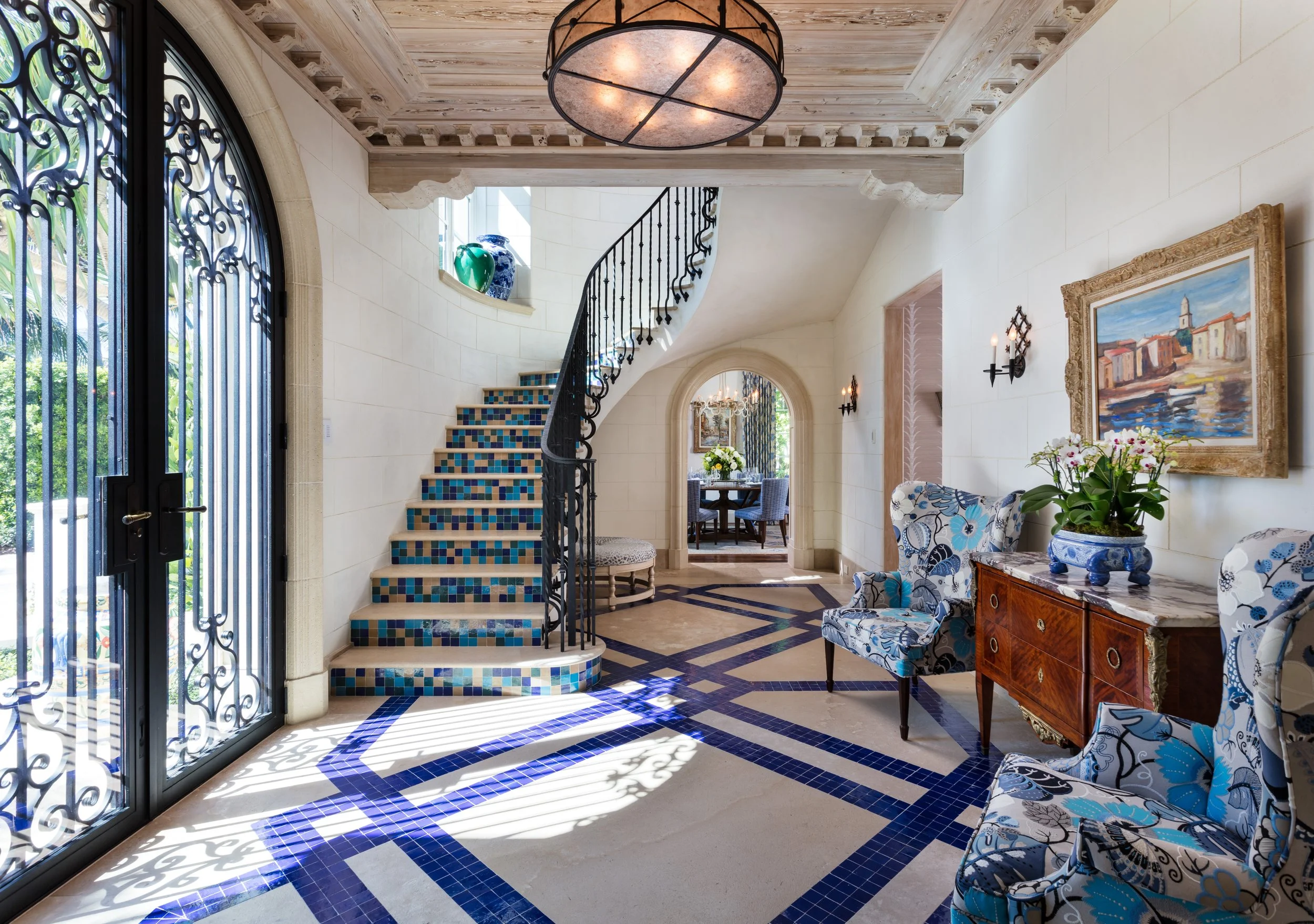 stunning-entry-with-bold-blue-tile-pattern-on-floor-elegant-stairway.jpg