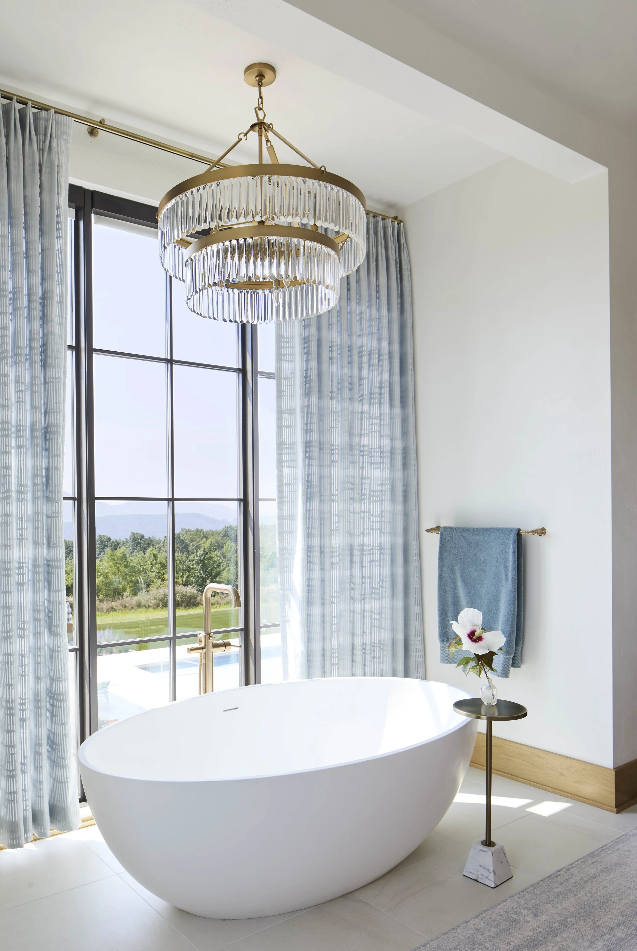modern-bath-with- soaking-tub-and-chandelier.jpg