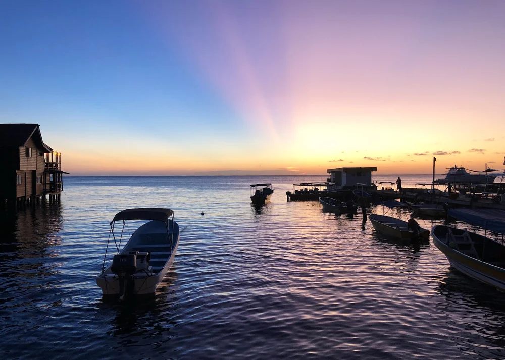 Sunset over the docks on Roat&aacute;n, Honduras