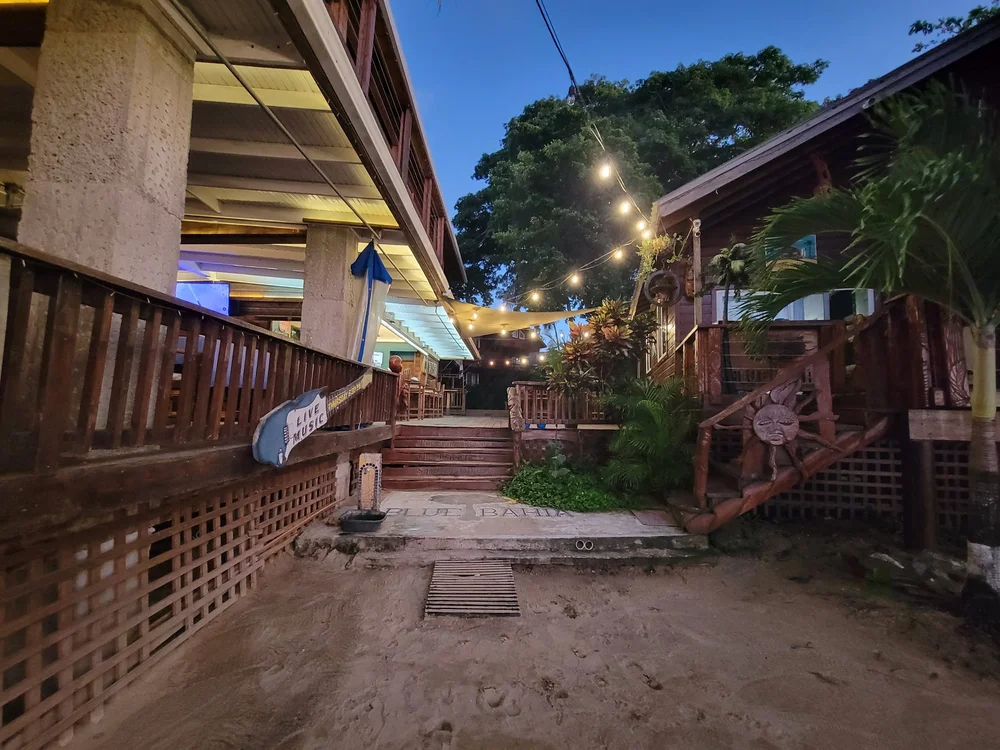 The Beach Grill deck at Blue Bahia Resort lit up in the evening