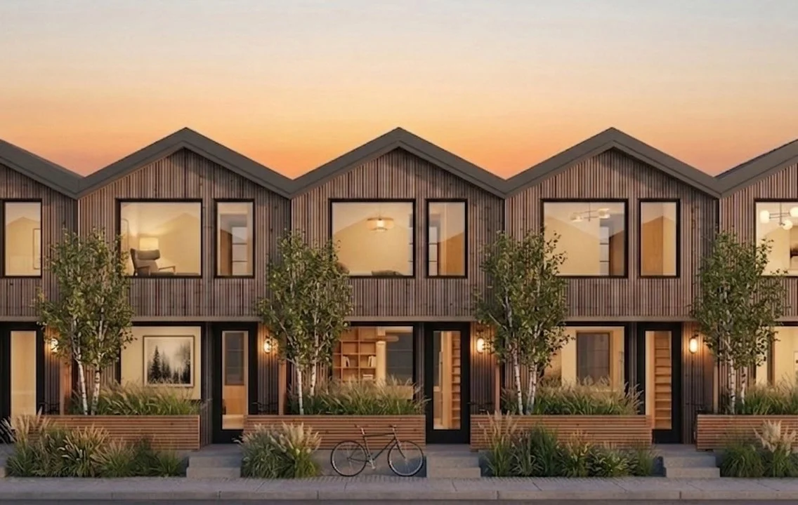 Rendering of Seahaus TBS-222, a two-story compact starter-home townhouse proposal with gabled roofs, wood cladding, planted entries, and shared street frontage.