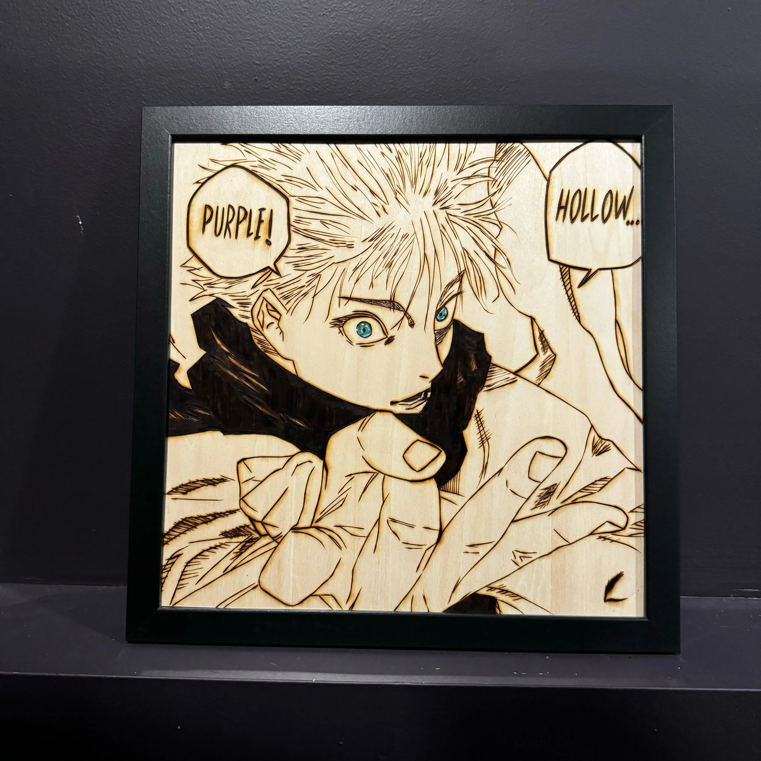 A framed wooden panel features a black and white manga-style drawing of a character with spiky hair and blue eyes, pointing forward with text bubbles saying "Purple!" and "Hollow..."
