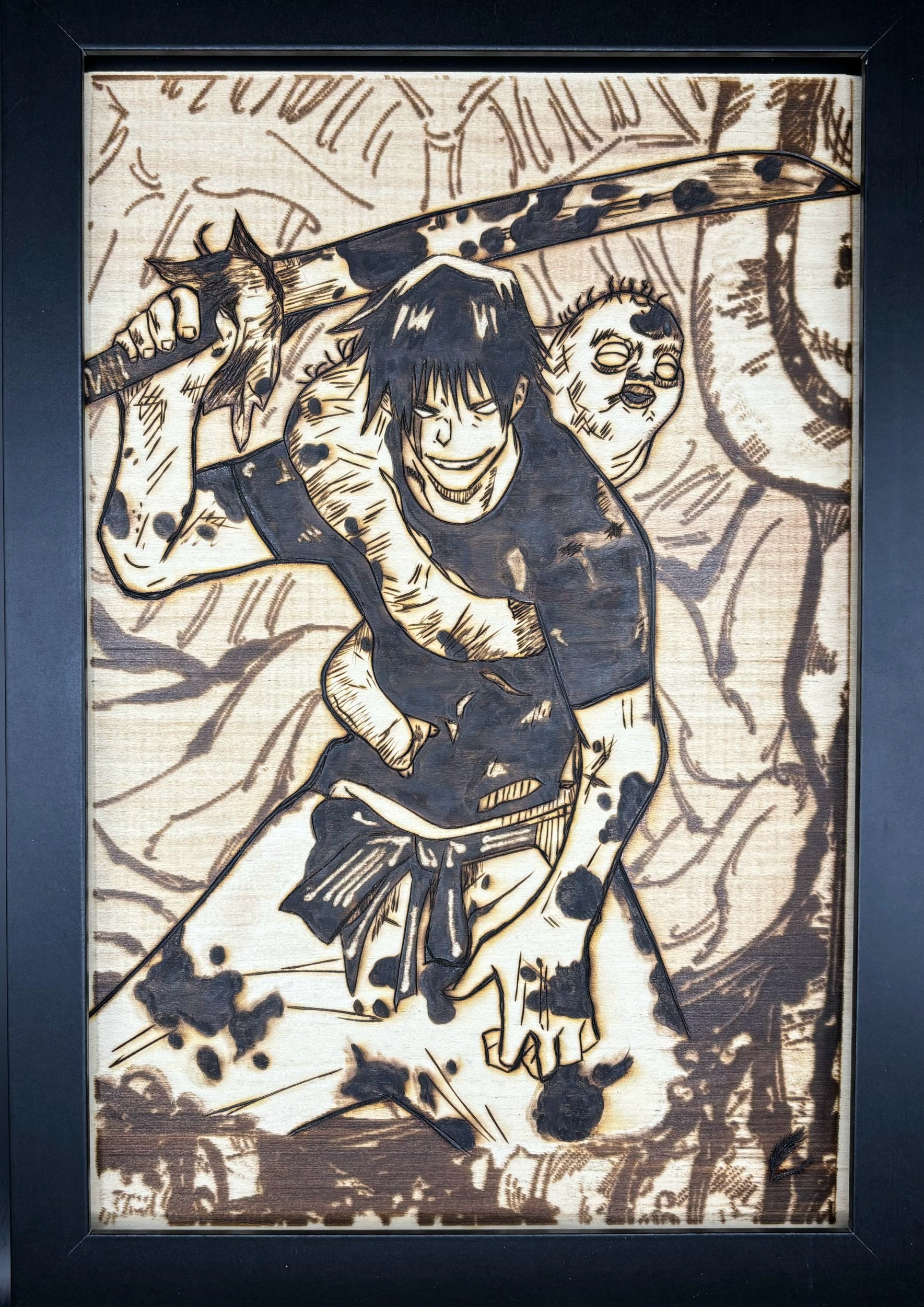 Wooden artwork depicting a smiling man with black hair, holding a large spear with an animal head attached, dressed in a black shirt and tied cloth around waist. The background features stylized trees.