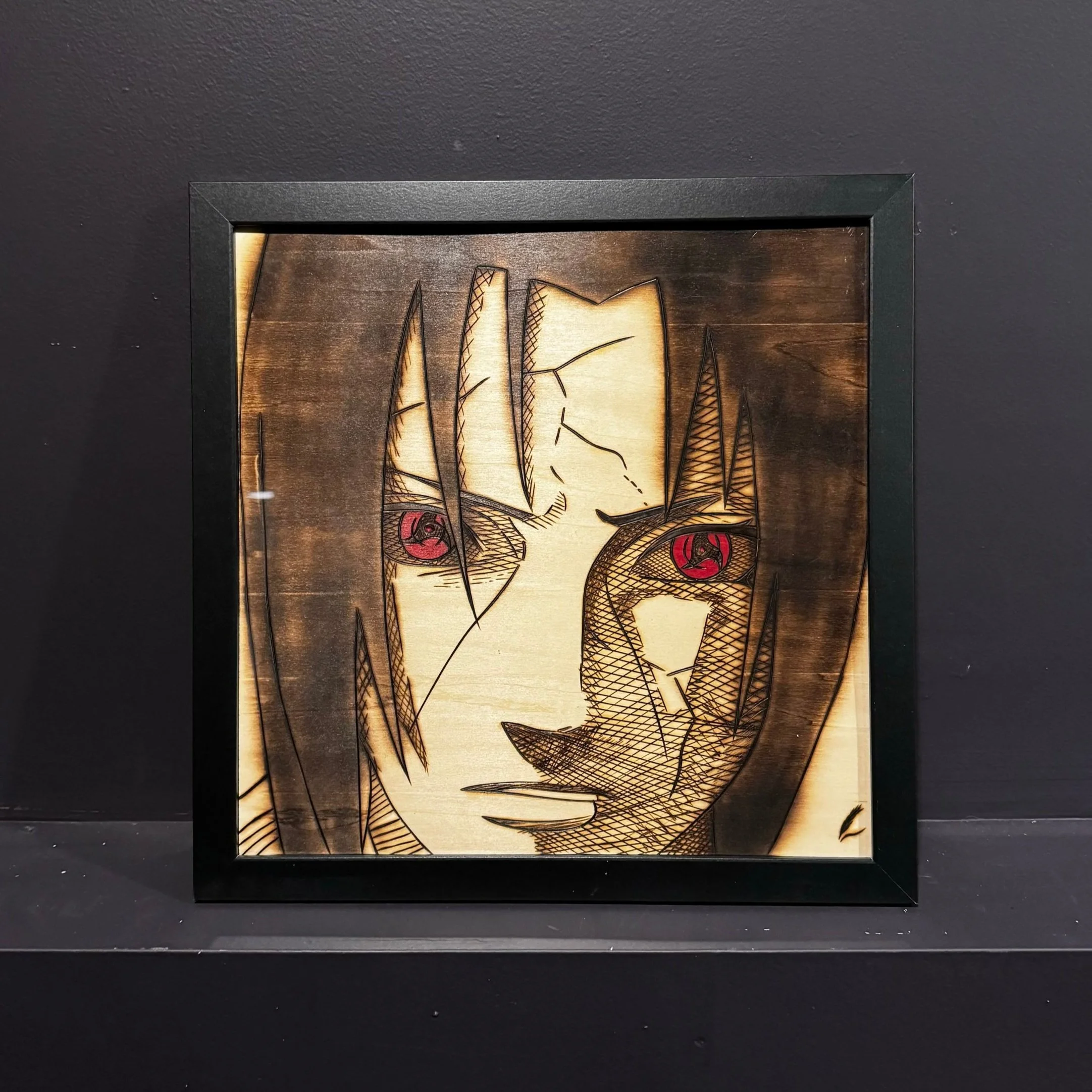 Framed wood art depicting a close-up of a female anime character with brown hair and red eyes.