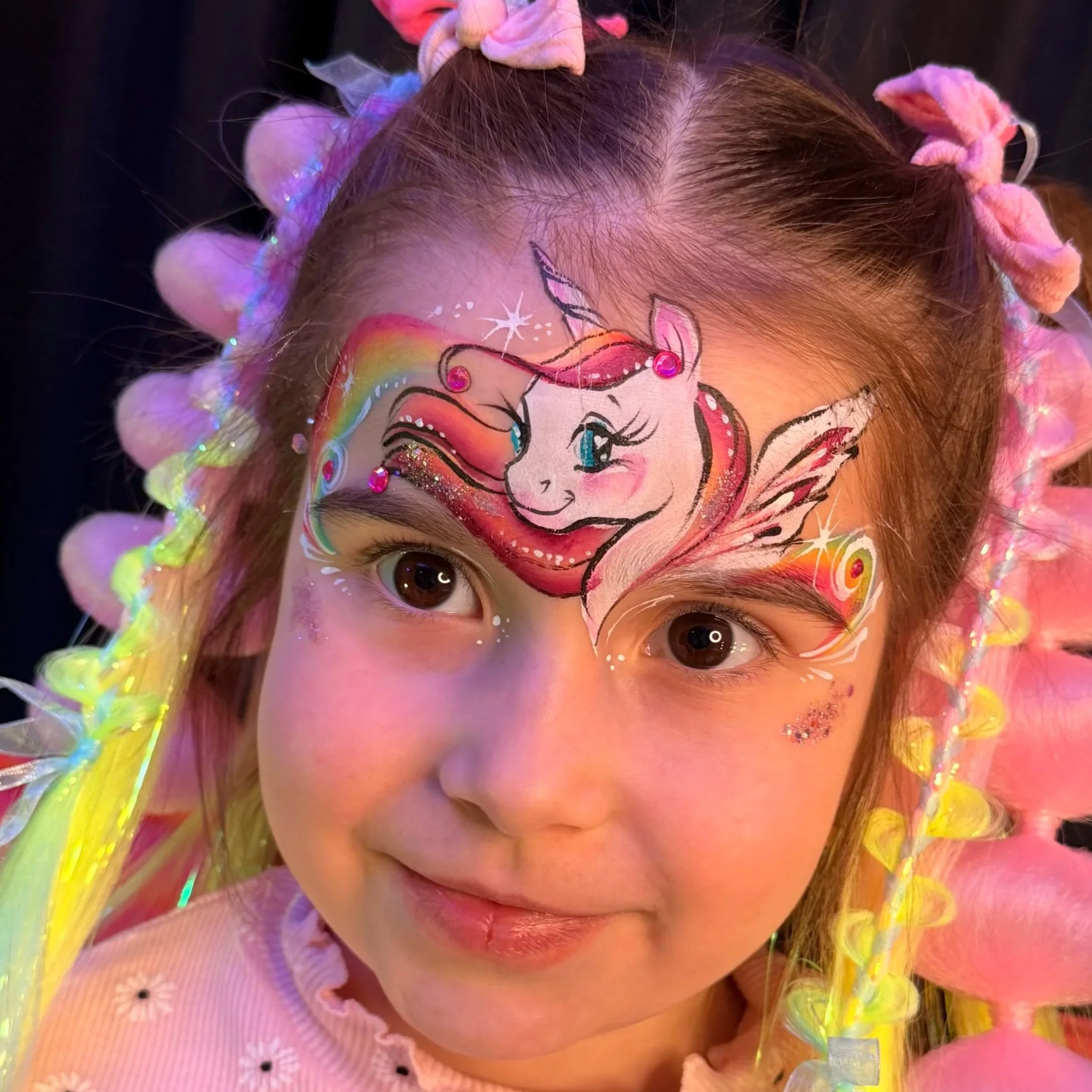 Luxury unicorn face painting with gems and glitter for high-end kids parties