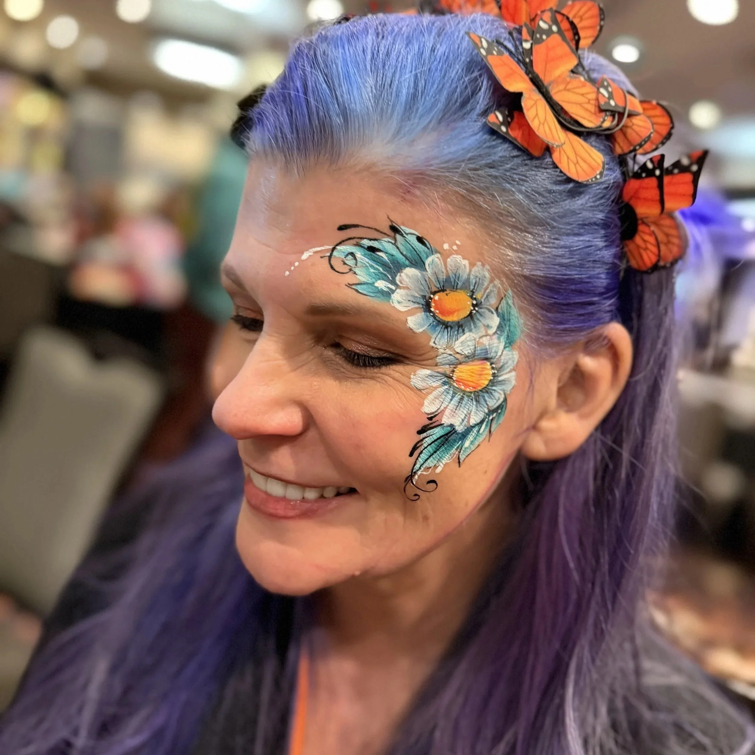 Elegant adult face painting and floral eye designs for high-end VIP events New York
