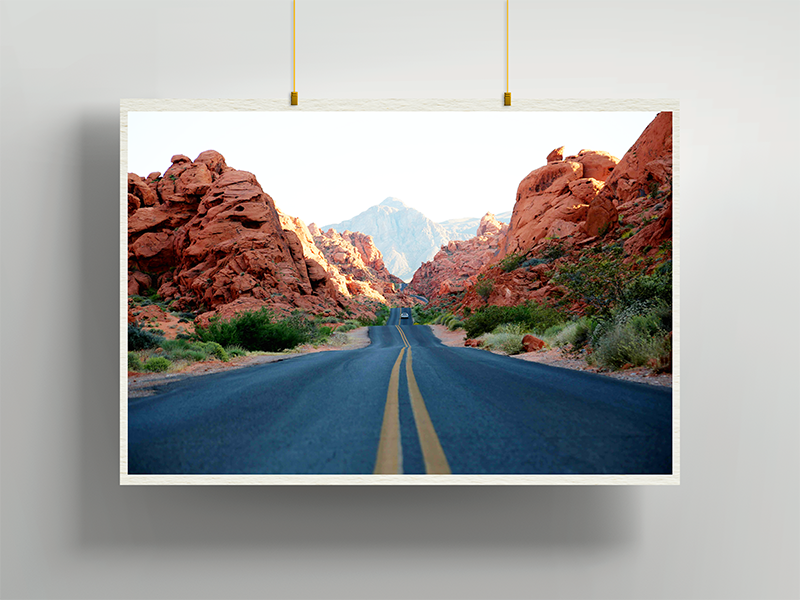 Rock ’n’ Drive by Dakota, contemporary landscape photography depicting an open highway cutting through rugged red rock terrain, curated by Landson Studios.