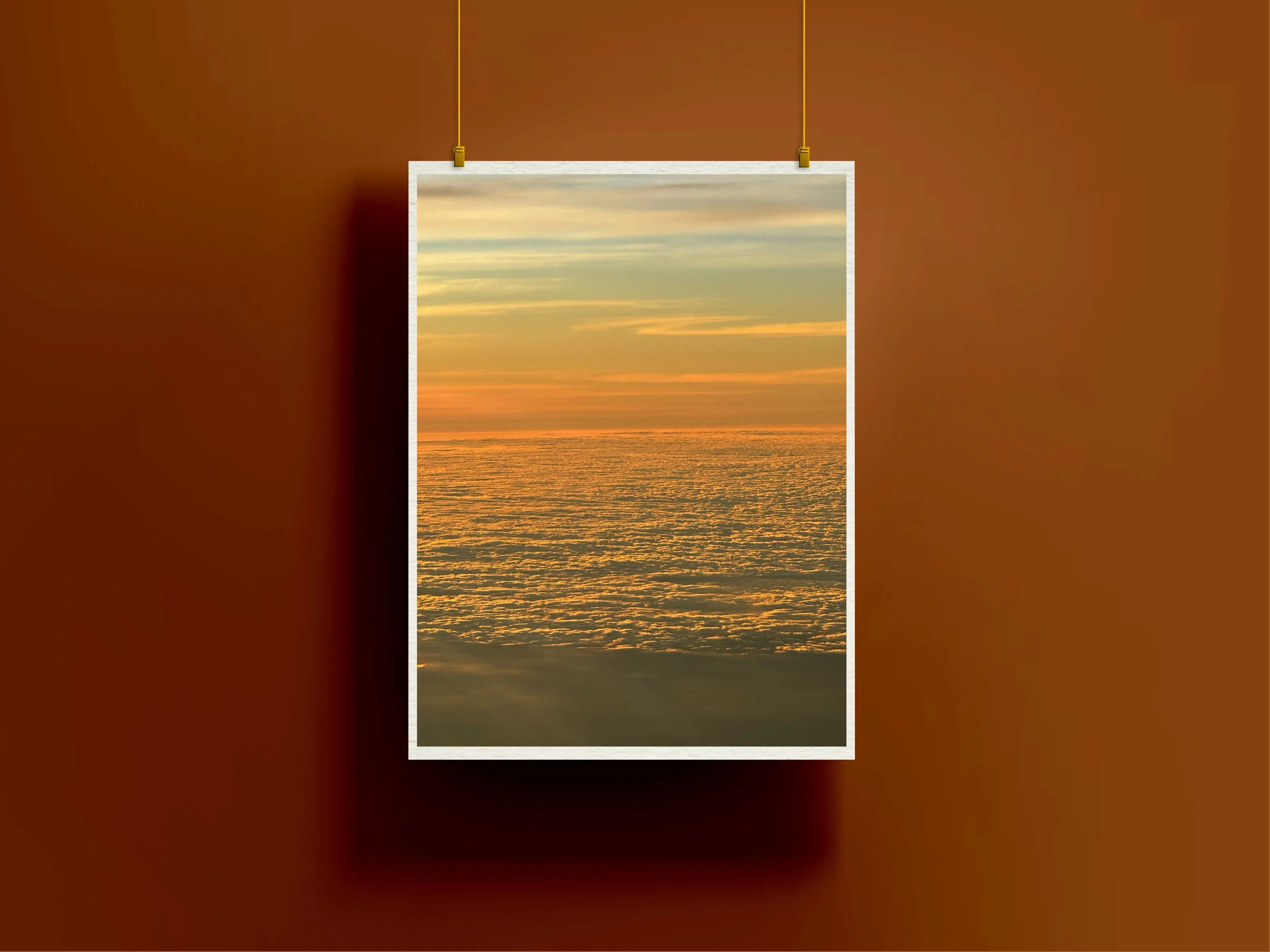 Above the Clouds by Dakota, fine art giclée print capturing an aerial view of glowing clouds beneath a softly layered sky, presented by Landson Studios.